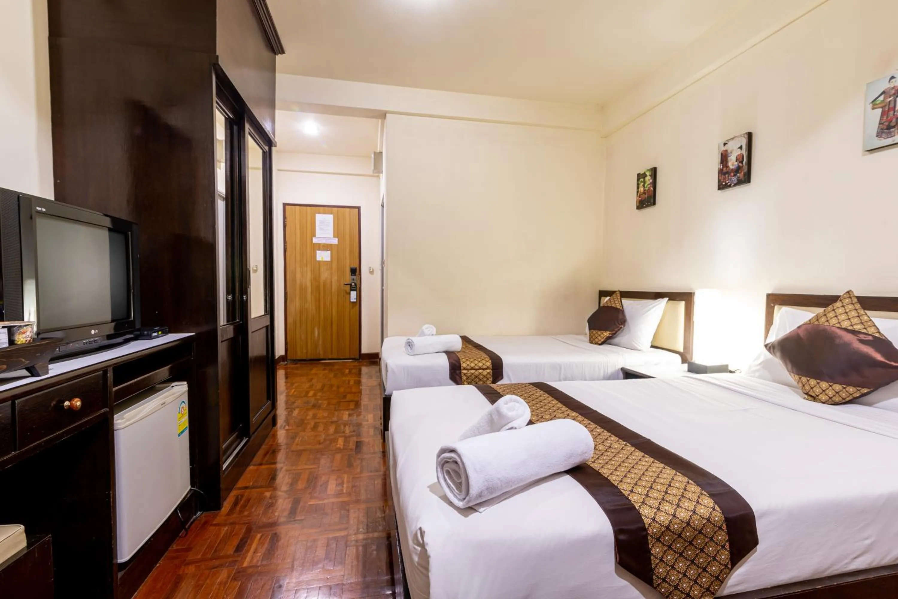 Bed in The Palm Garden Hotel