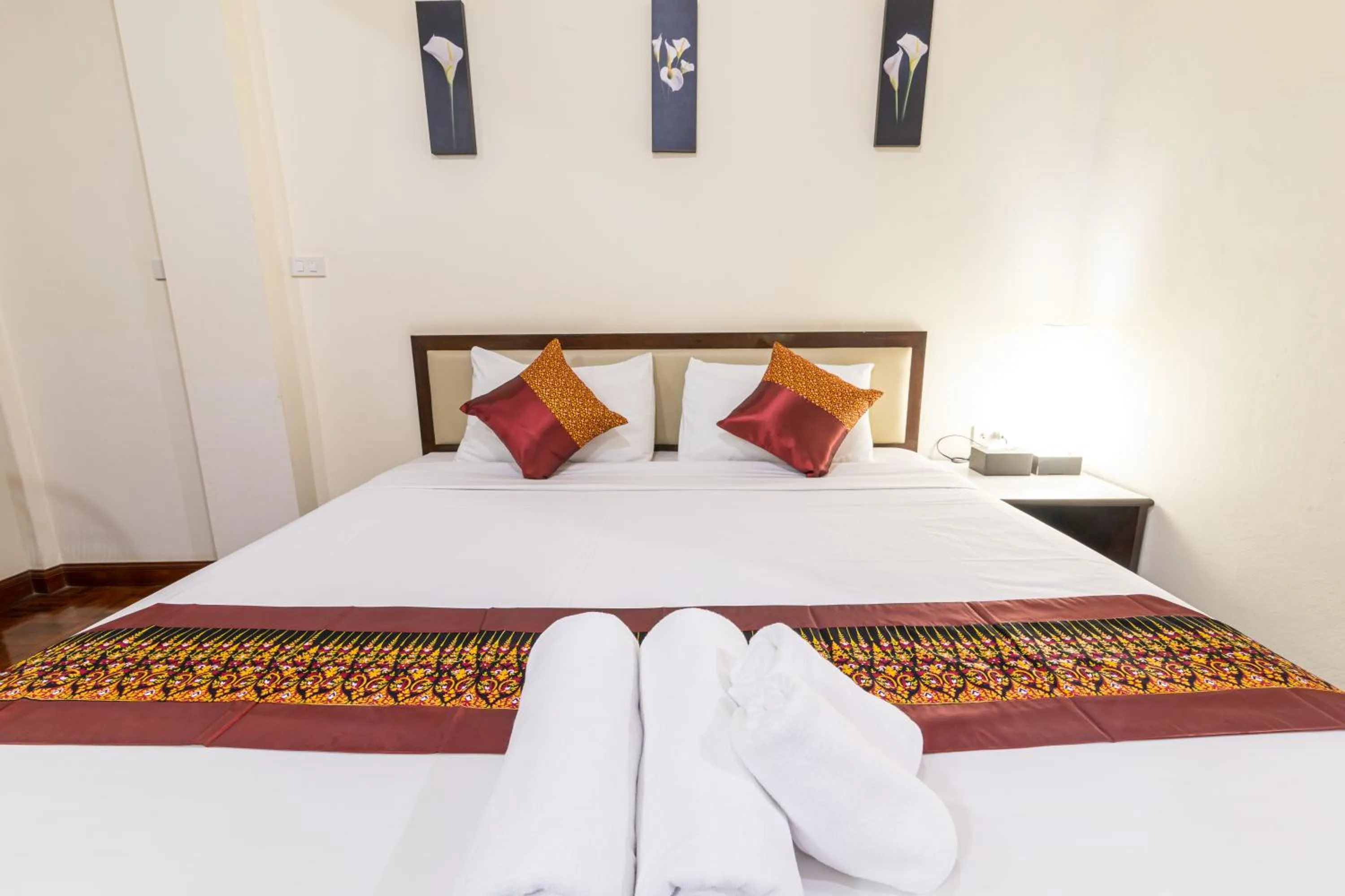 Bed in The Palm Garden Hotel