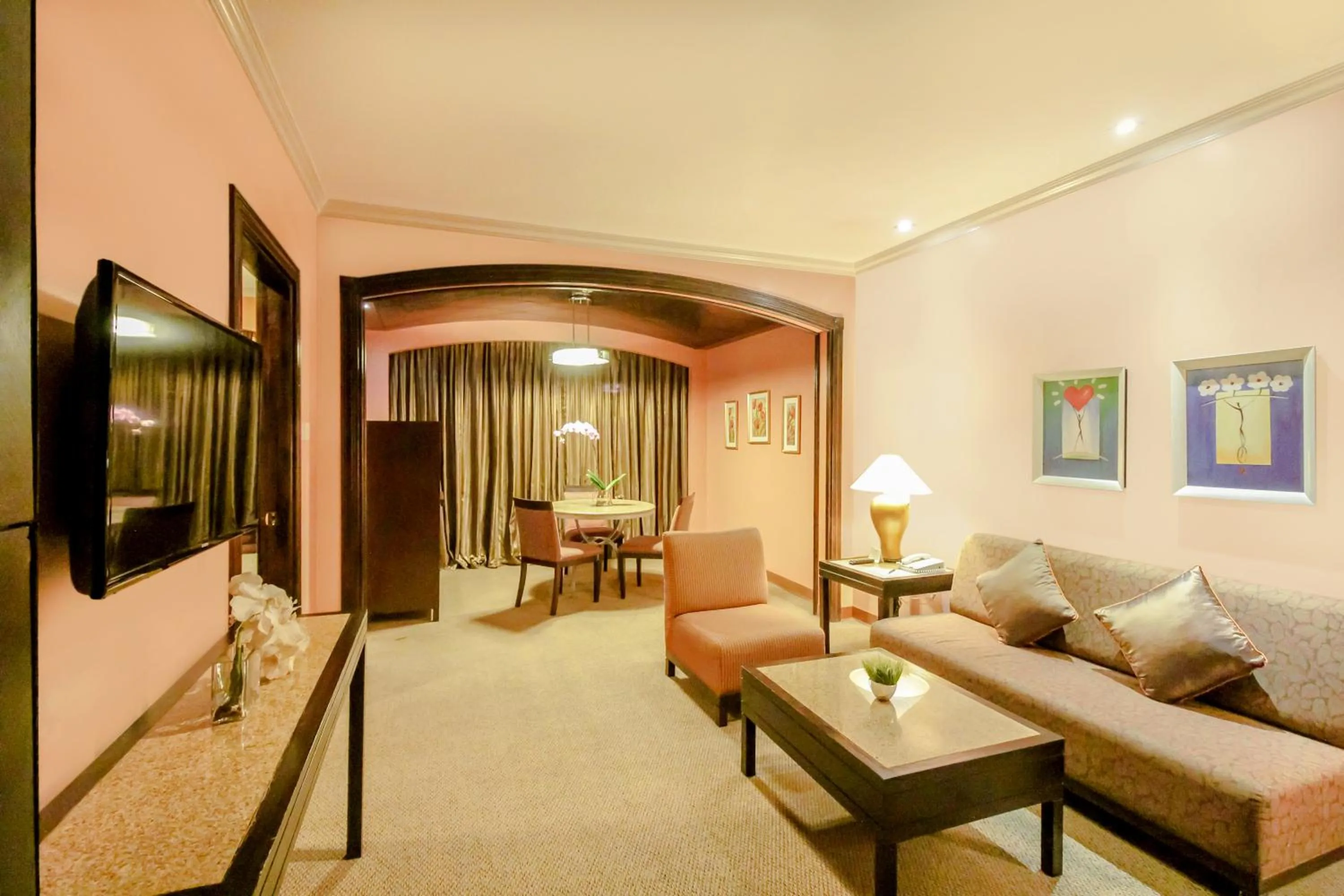 Living room, Bed in Makati Palace Hotel