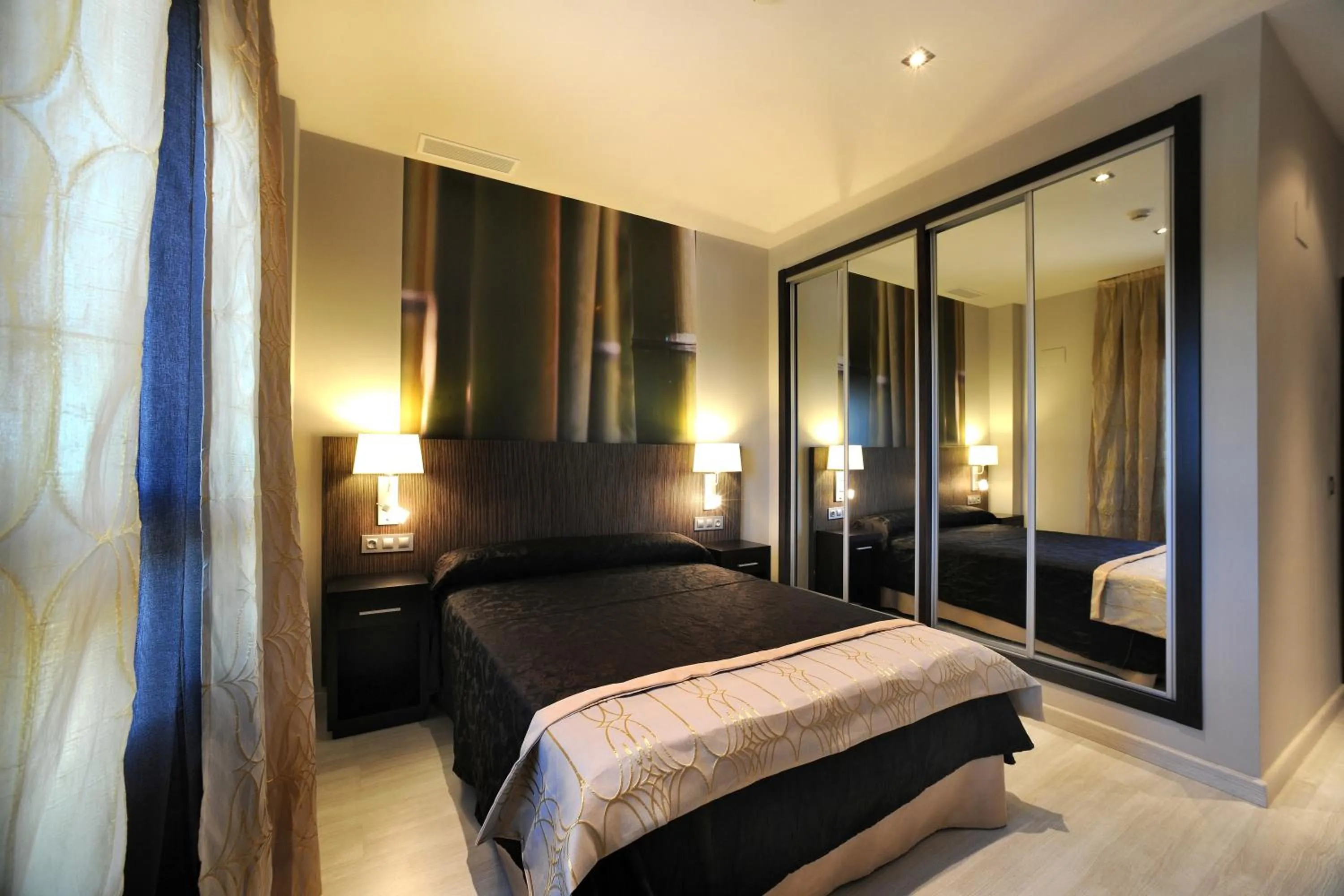 Bed in Leo Deluxe Punta Umbría