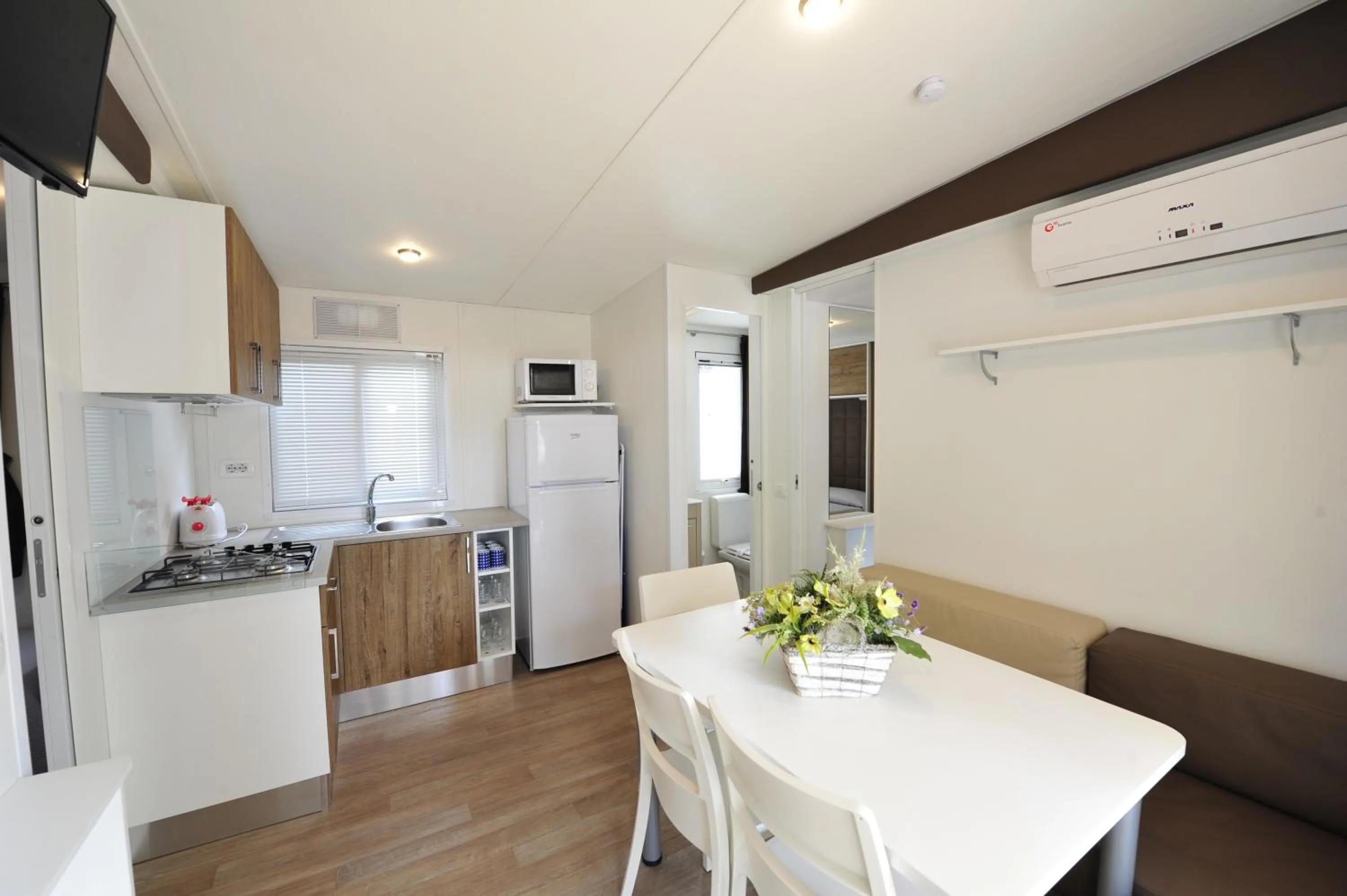 Kitchen or kitchenette in Camping Bella Italia