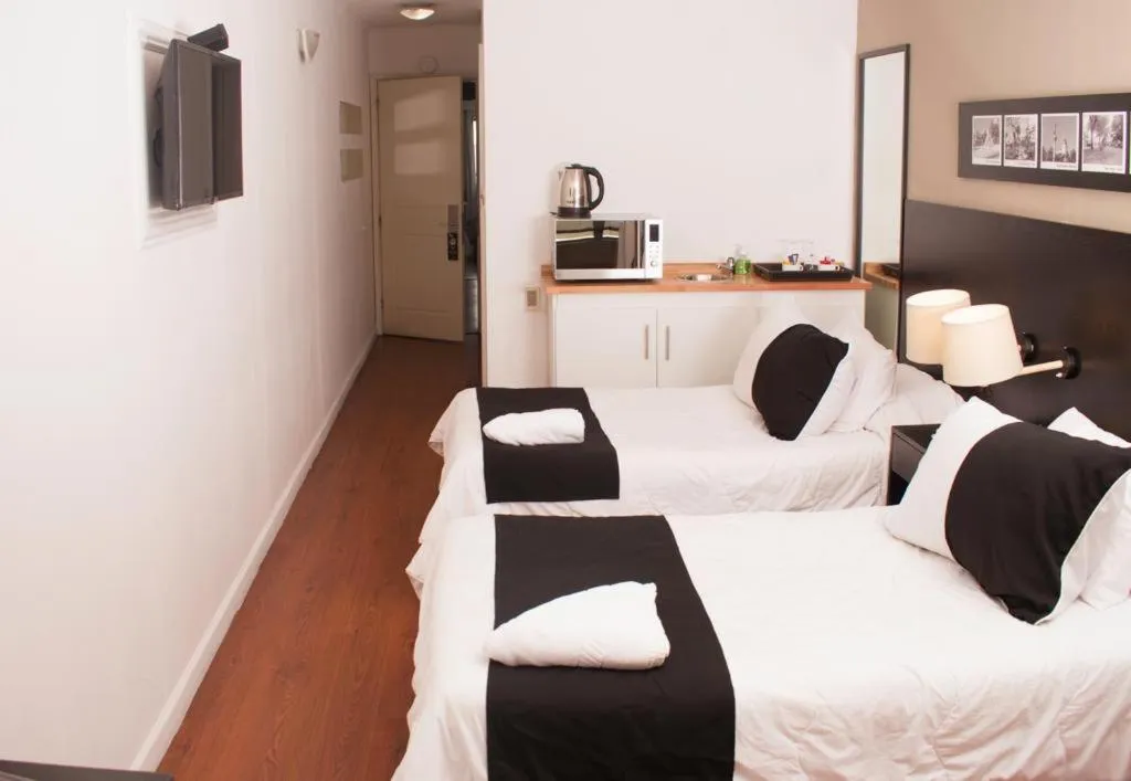 Bed in Pocitos Plaza Hotel