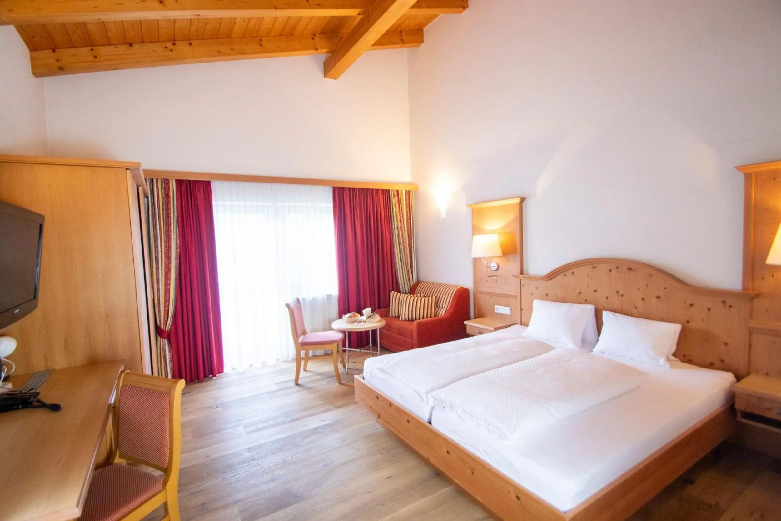 Seating area, Bed in Aktivhotel Waldhof