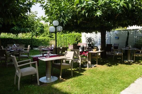 Garden view in Logis Hotel Grangier