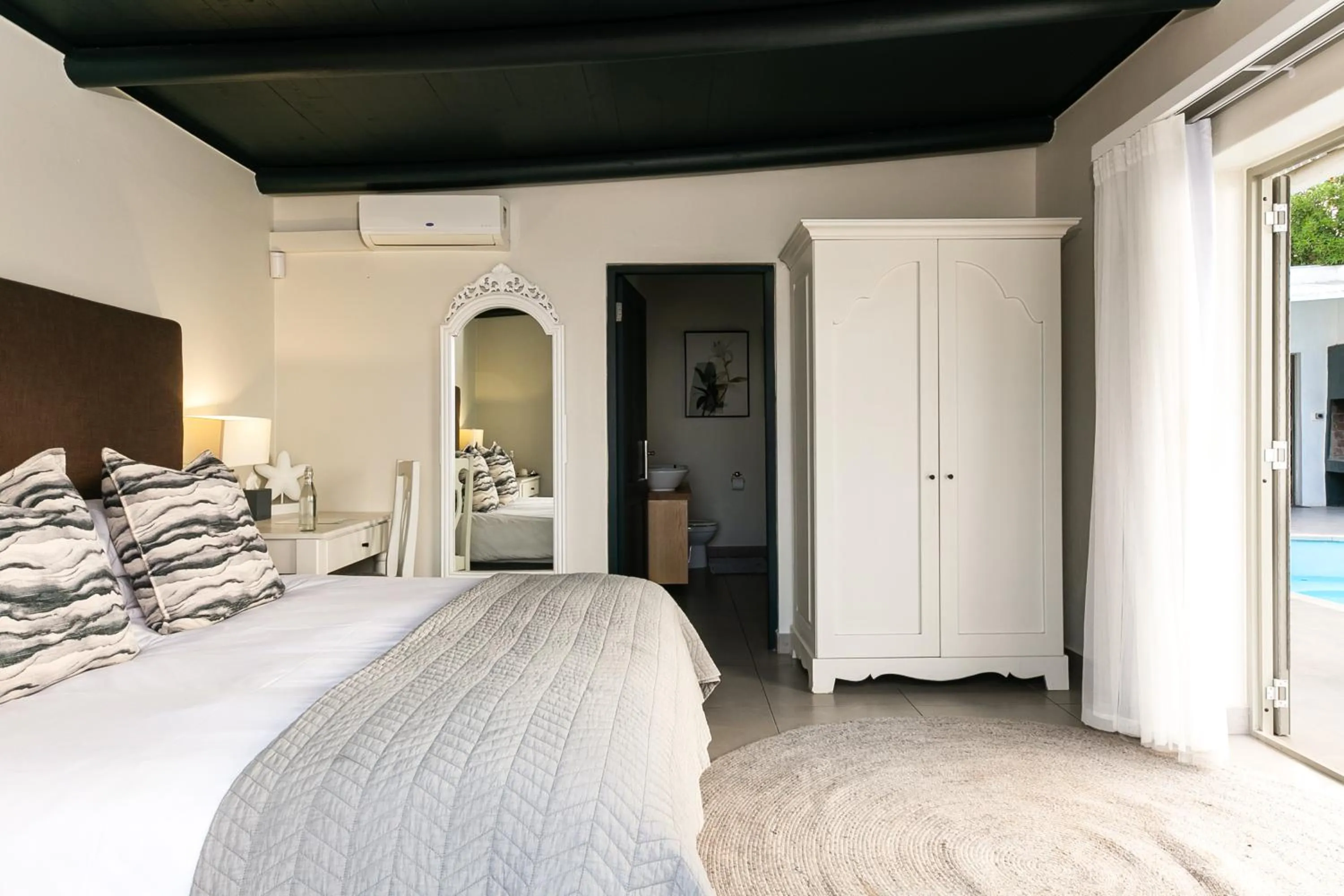 Bed in Abalone Hotel & Villas