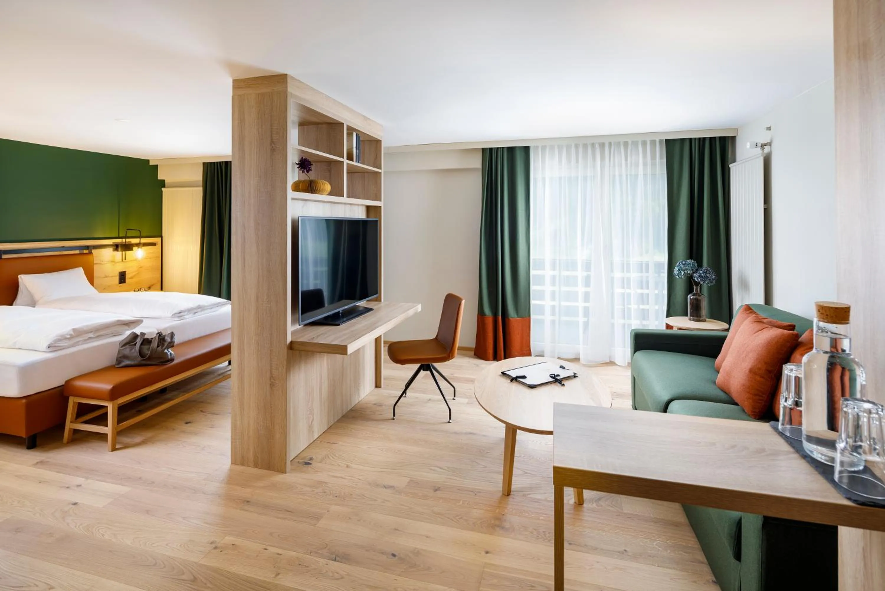 Living room, Bed in Hotel Hirschen Wildhaus