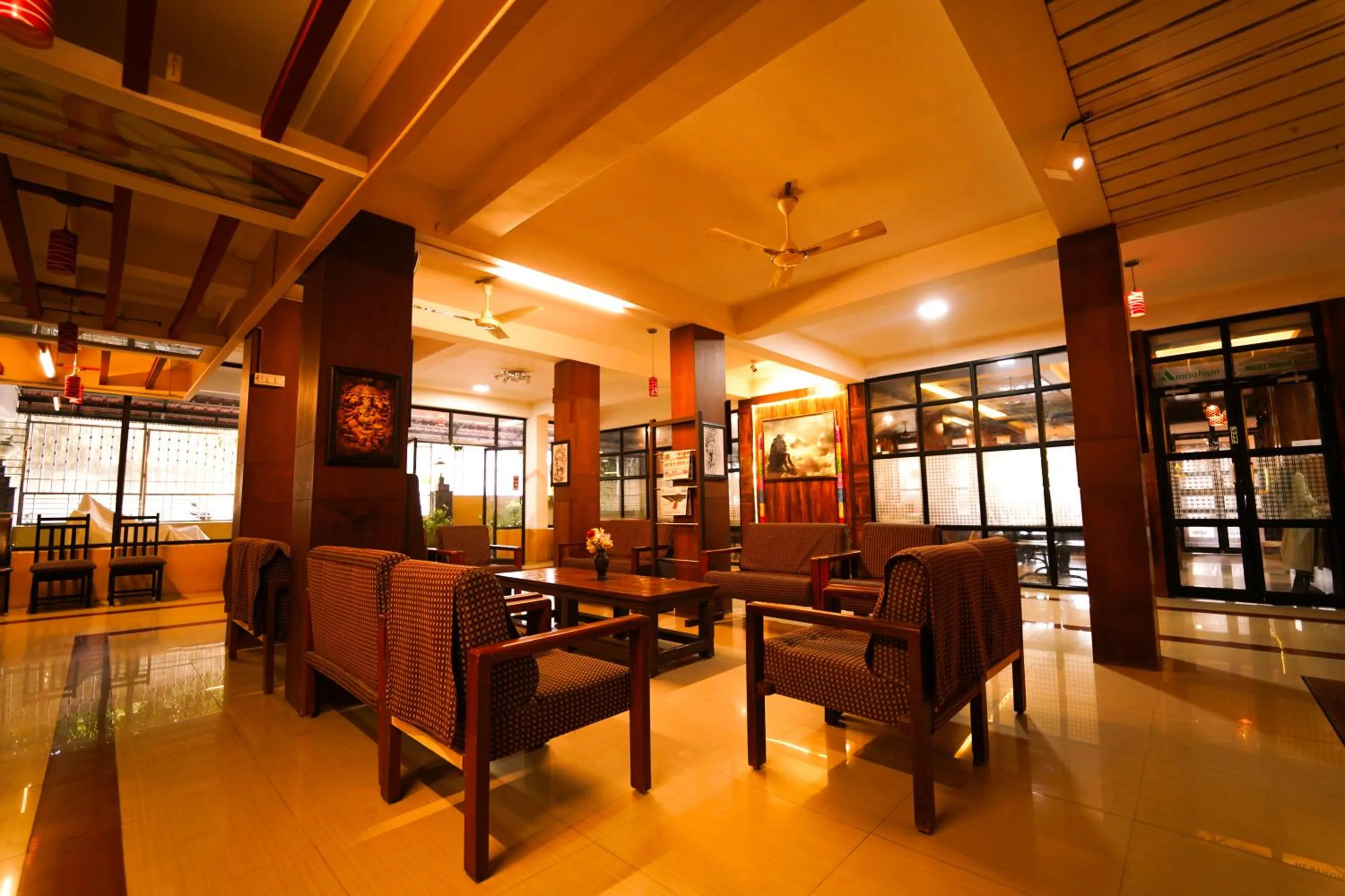 Seating area in HOTEL THIRD EYE by RAMANA TOWERS