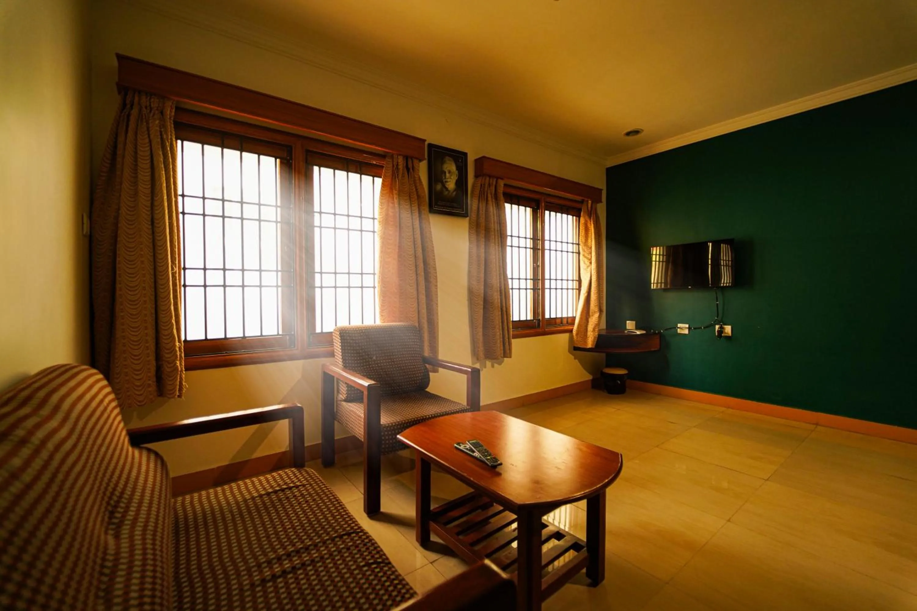 Seating area in HOTEL THIRD EYE by RAMANA TOWERS