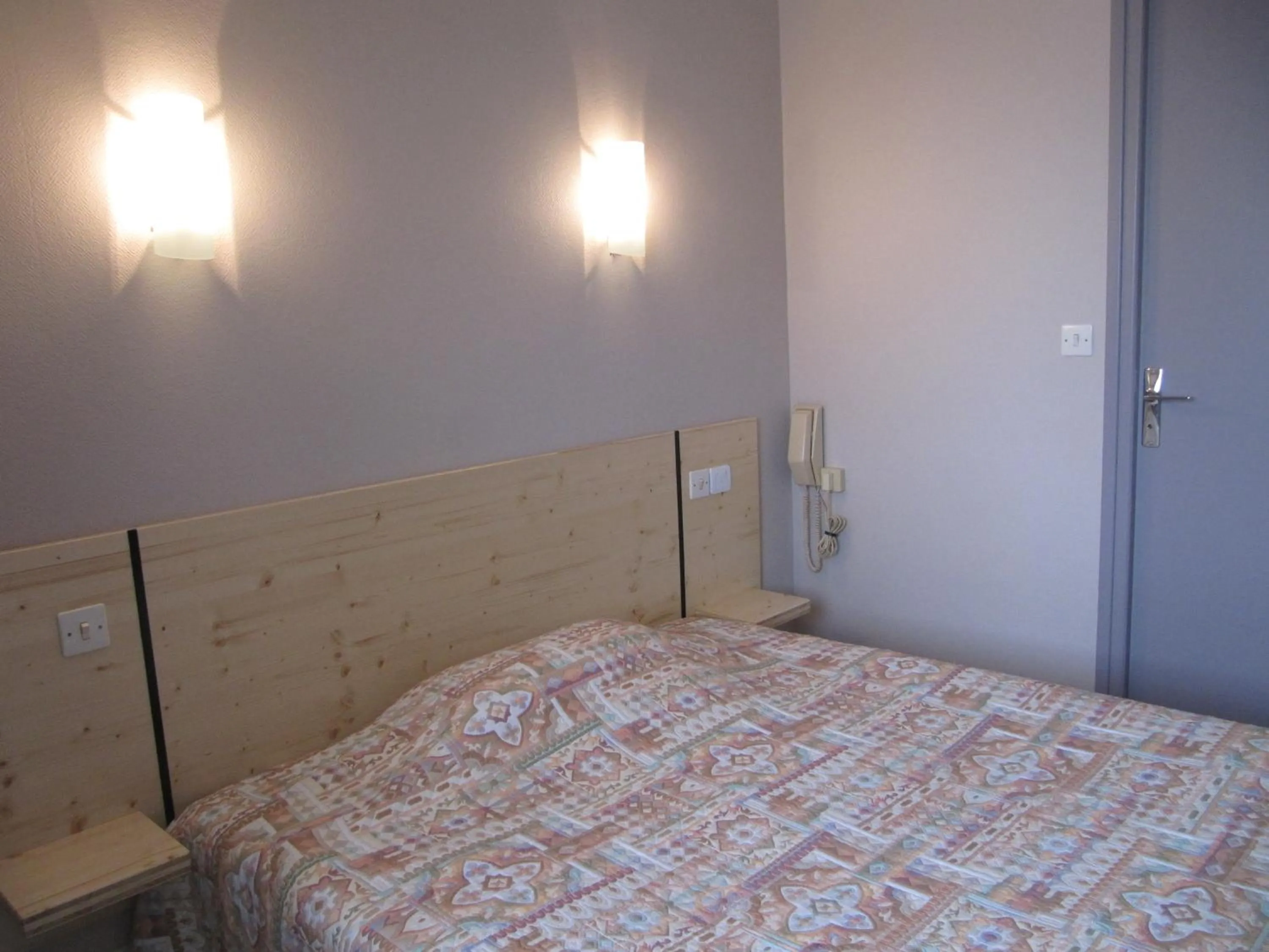 Bed in Hôtel Des Rochers