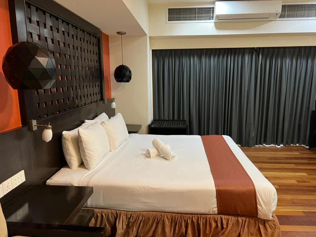 Bed in Raintree Resort Suites