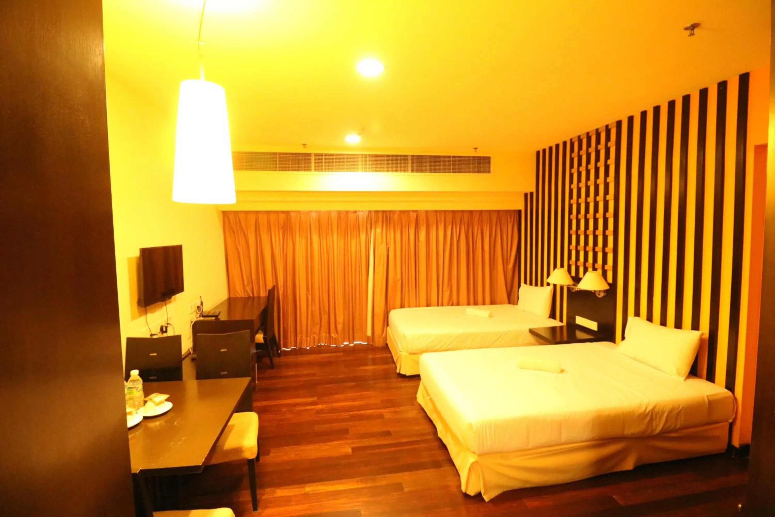 Photo of the whole room, Bed in Raintree Resort Suites