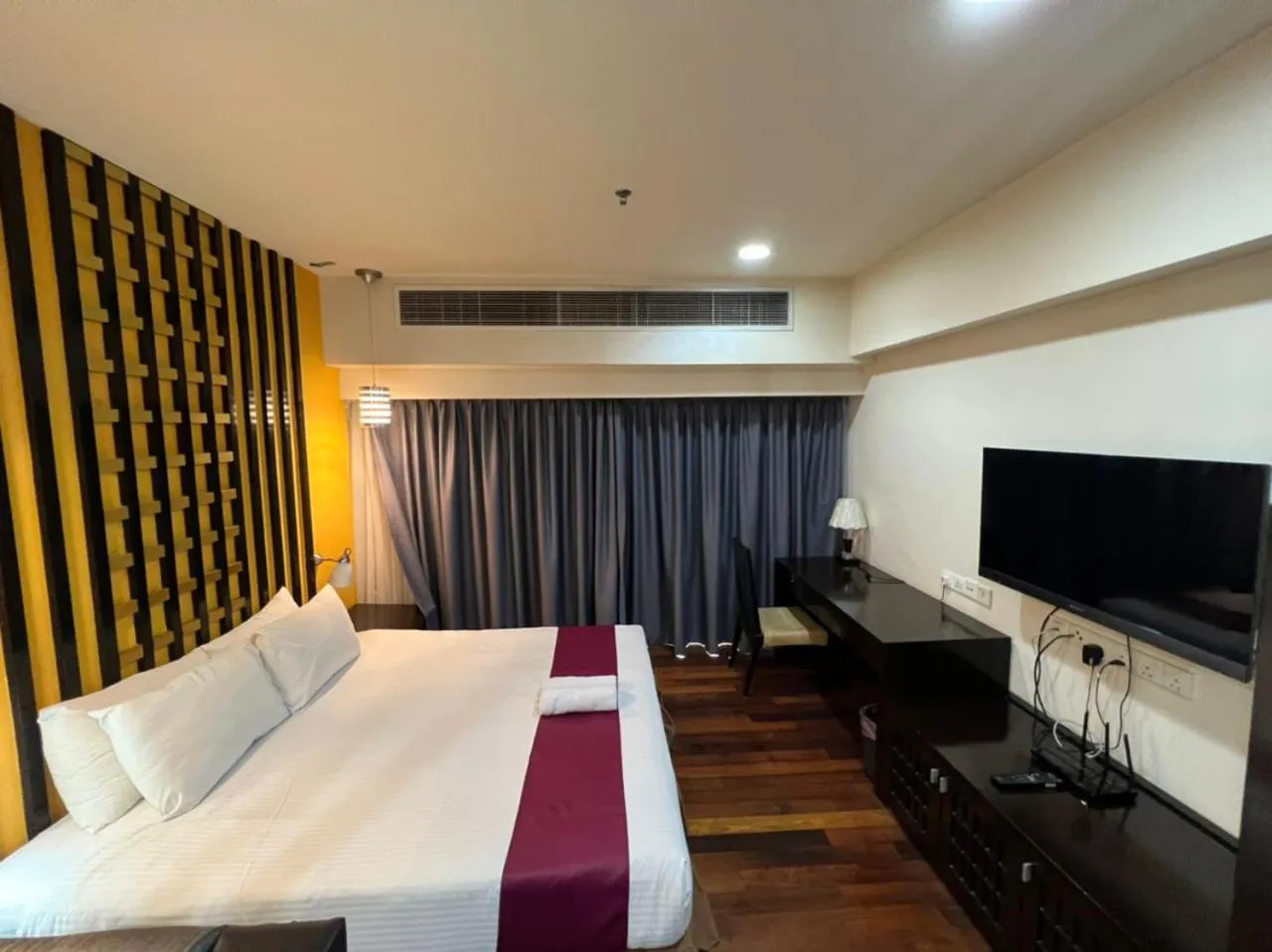 Bed in Raintree Resort Suites