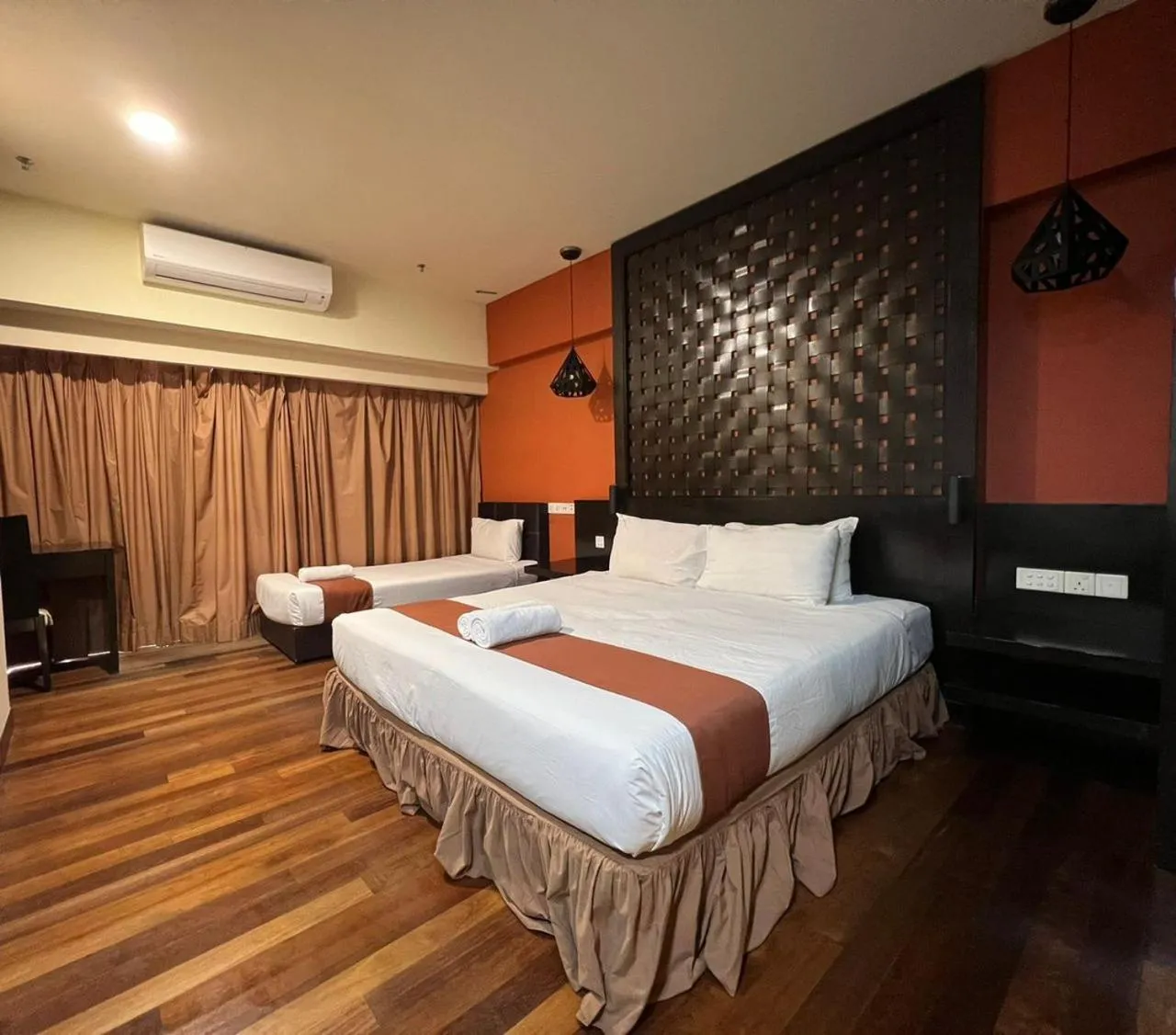 Bed in Raintree Resort Suites