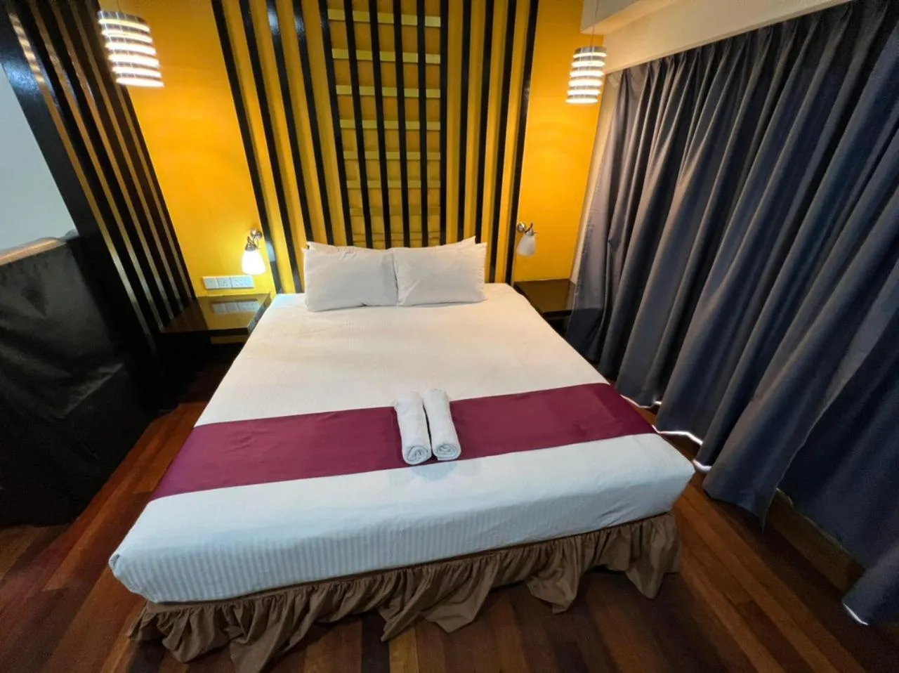 Bed in Raintree Resort Suites