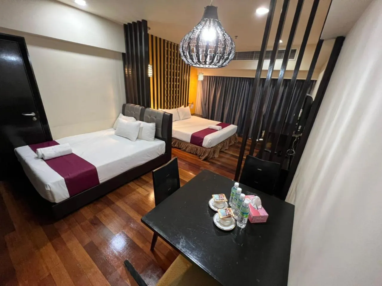 Bed in Raintree Resort Suites