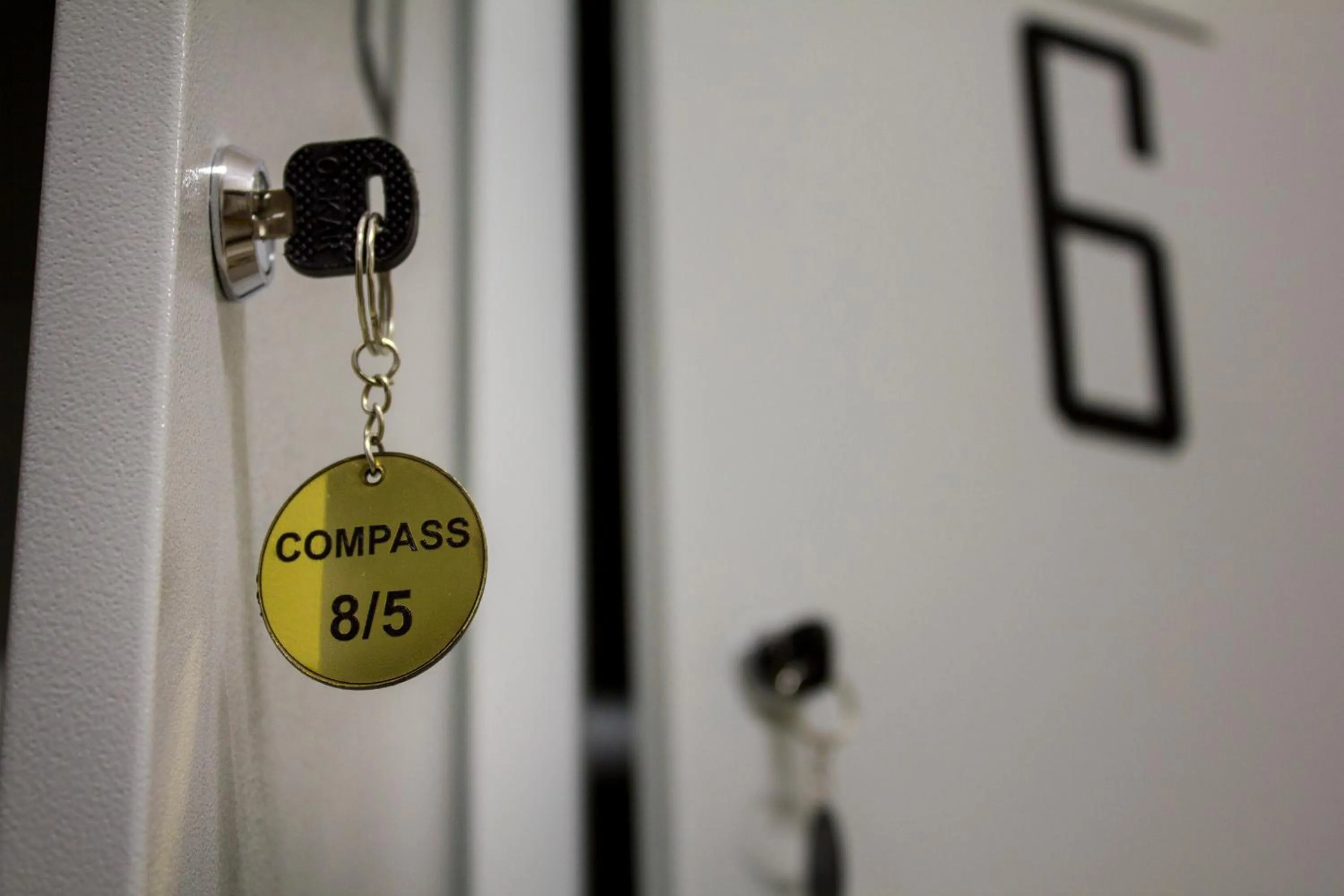 Property logo or sign in Compass Hostel