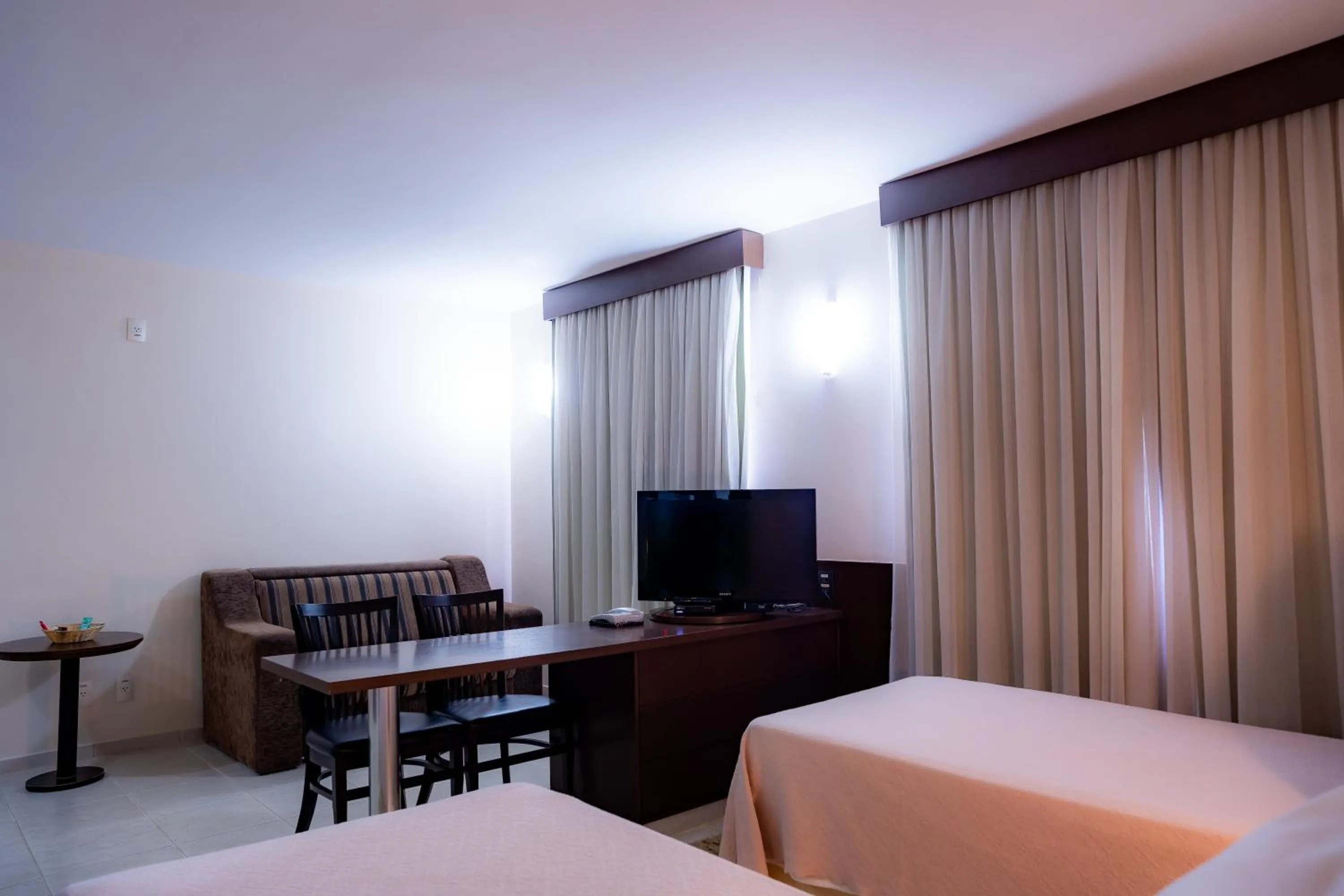 Bed in Hotel Santos Dumont