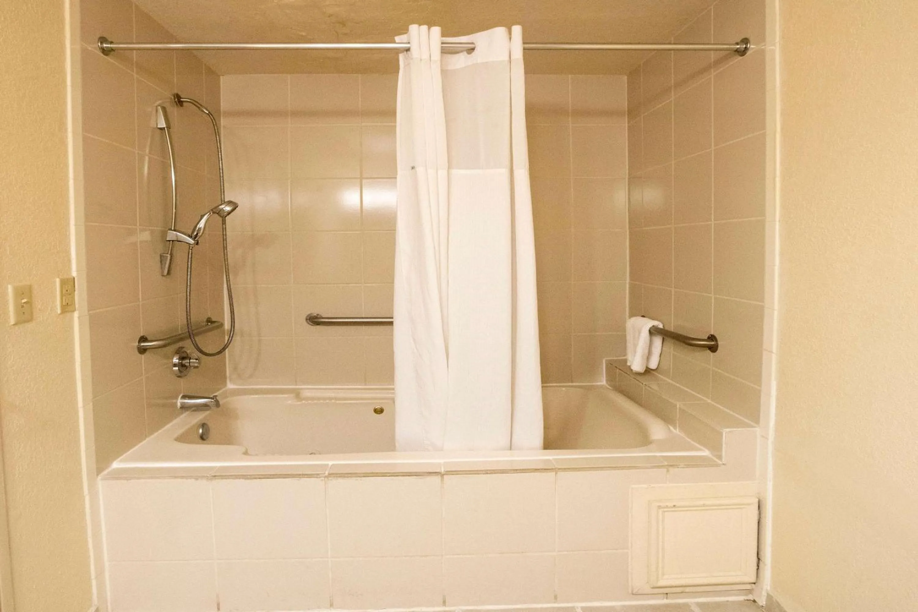 Bathroom in Days Inn & Suites by Wyndham Houston North/Aldine