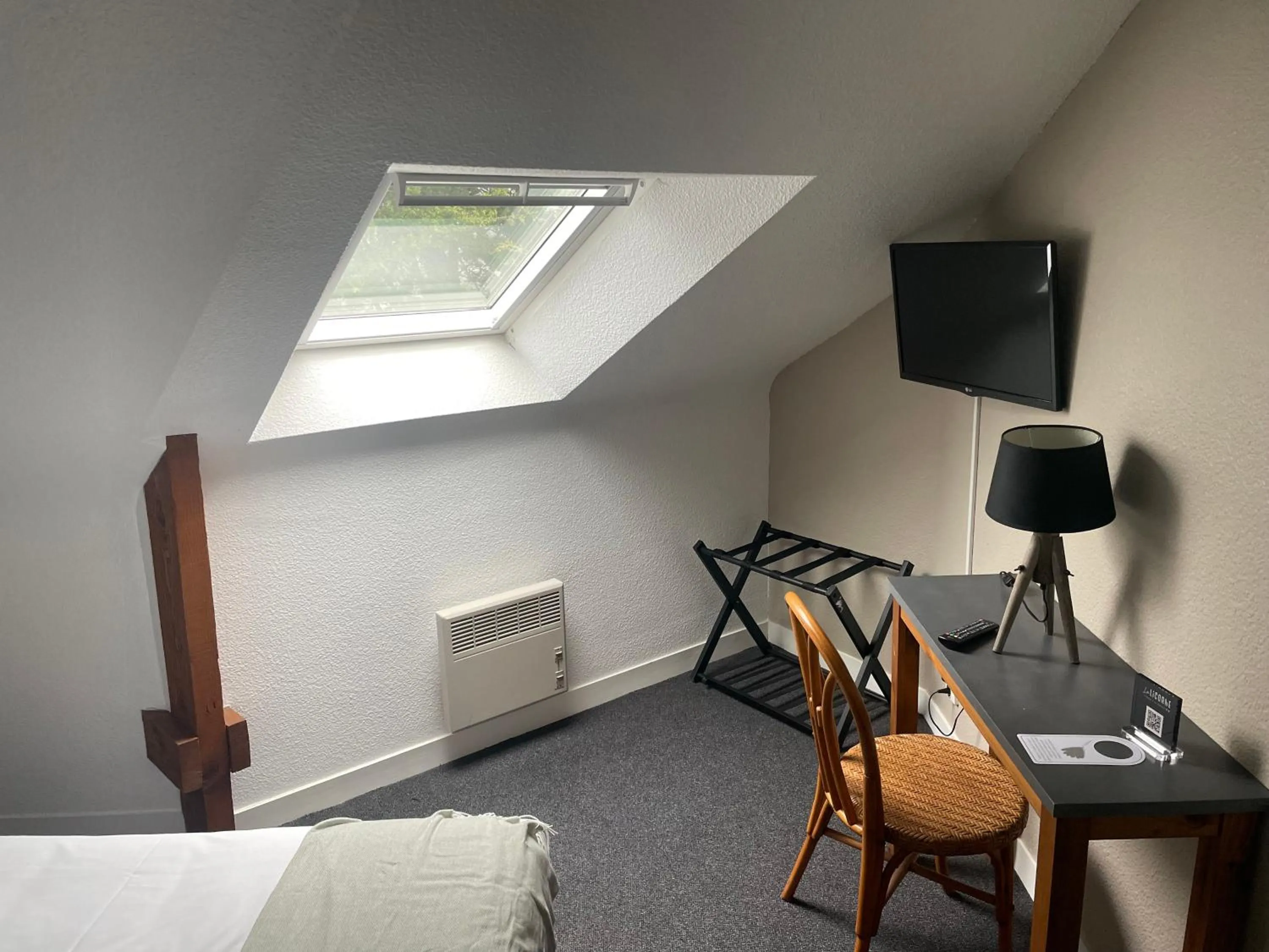 Bedroom in Hotel La Licorne