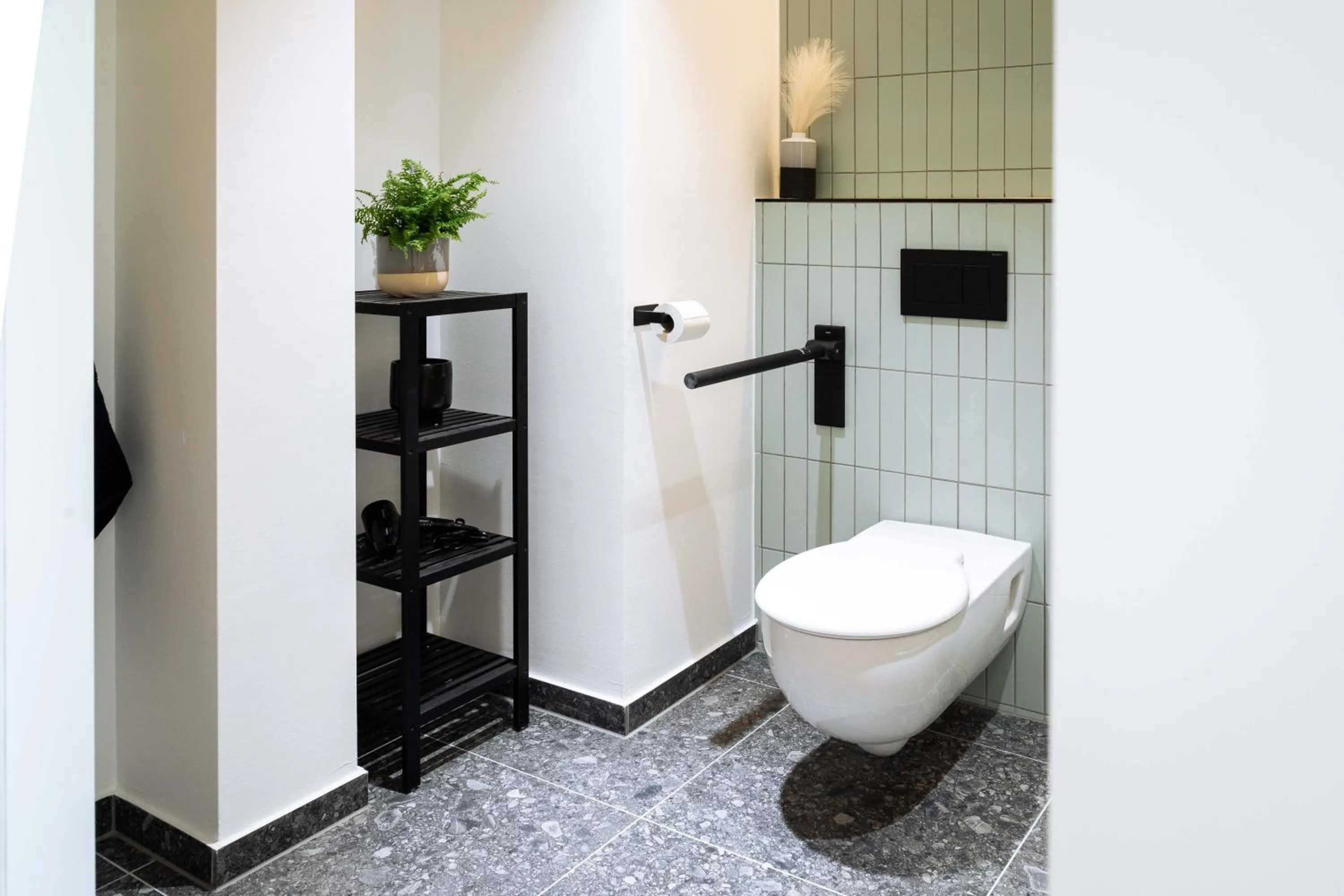 Toilet in Urban Jungle Apartments