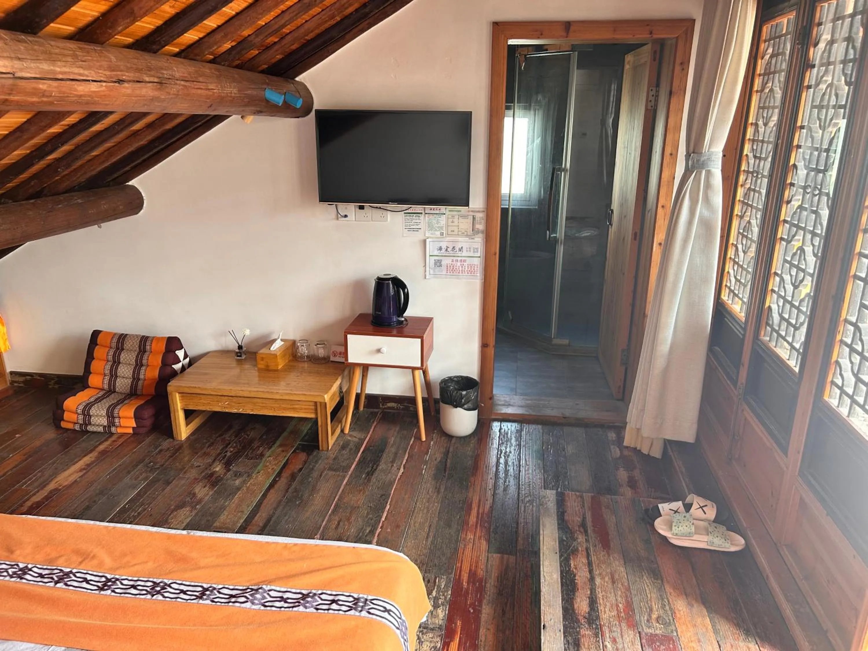 Bed in Tongli Begonia Flowers Guesthouse