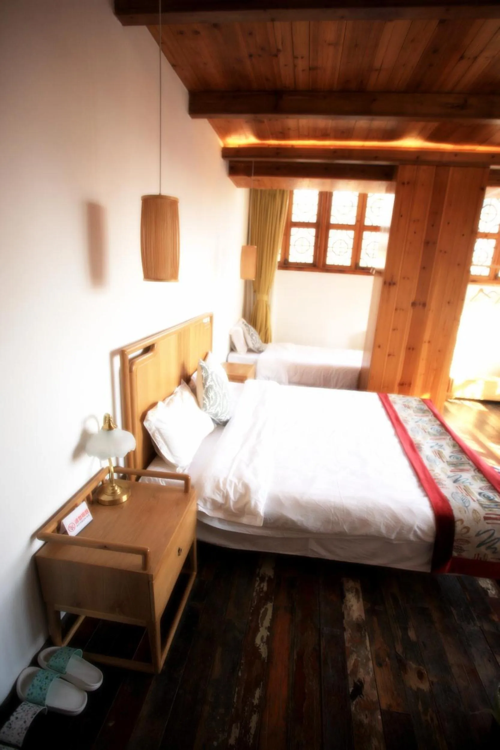 Bed in Tongli Begonia Flowers Guesthouse