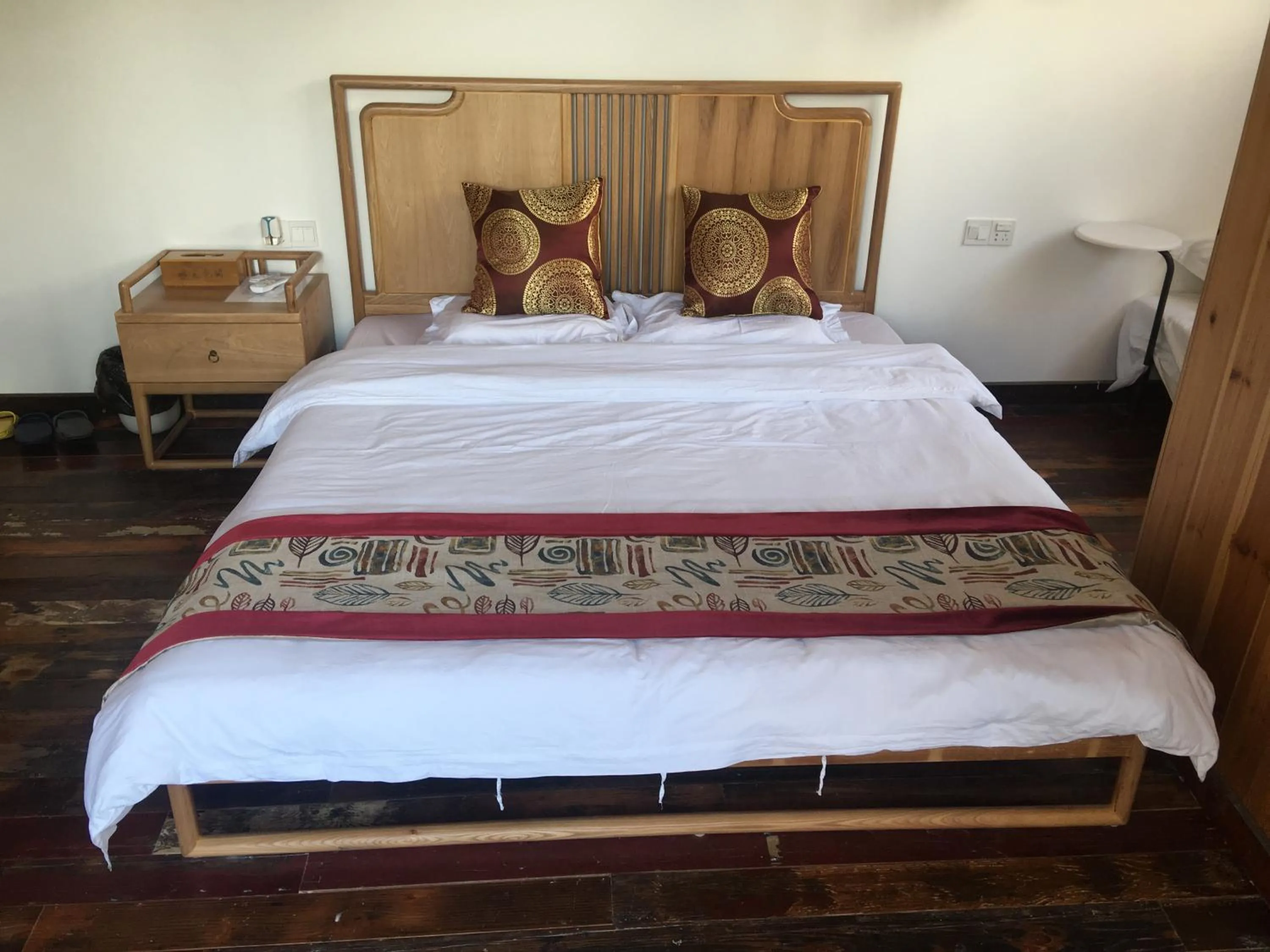 Bed in Tongli Begonia Flowers Guesthouse