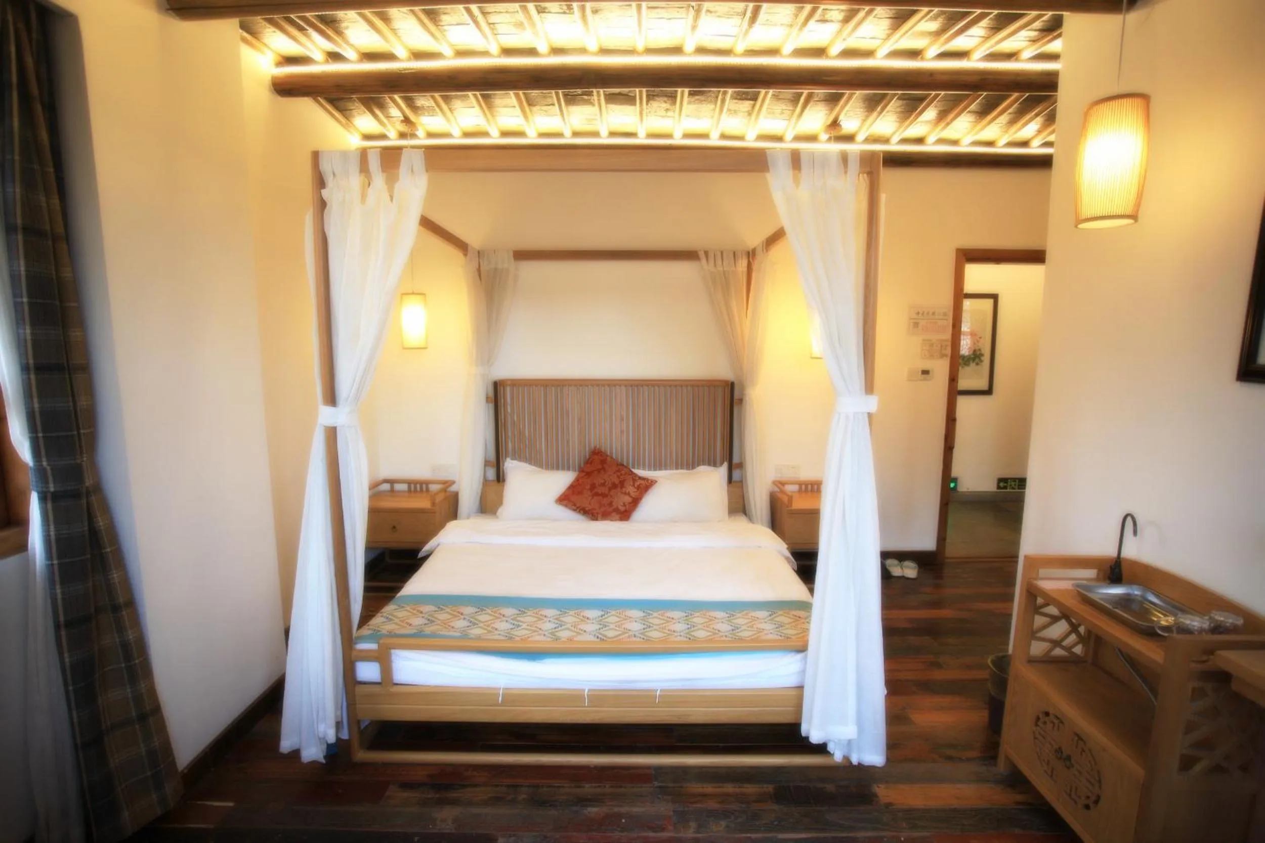 Bed in Tongli Begonia Flowers Guesthouse