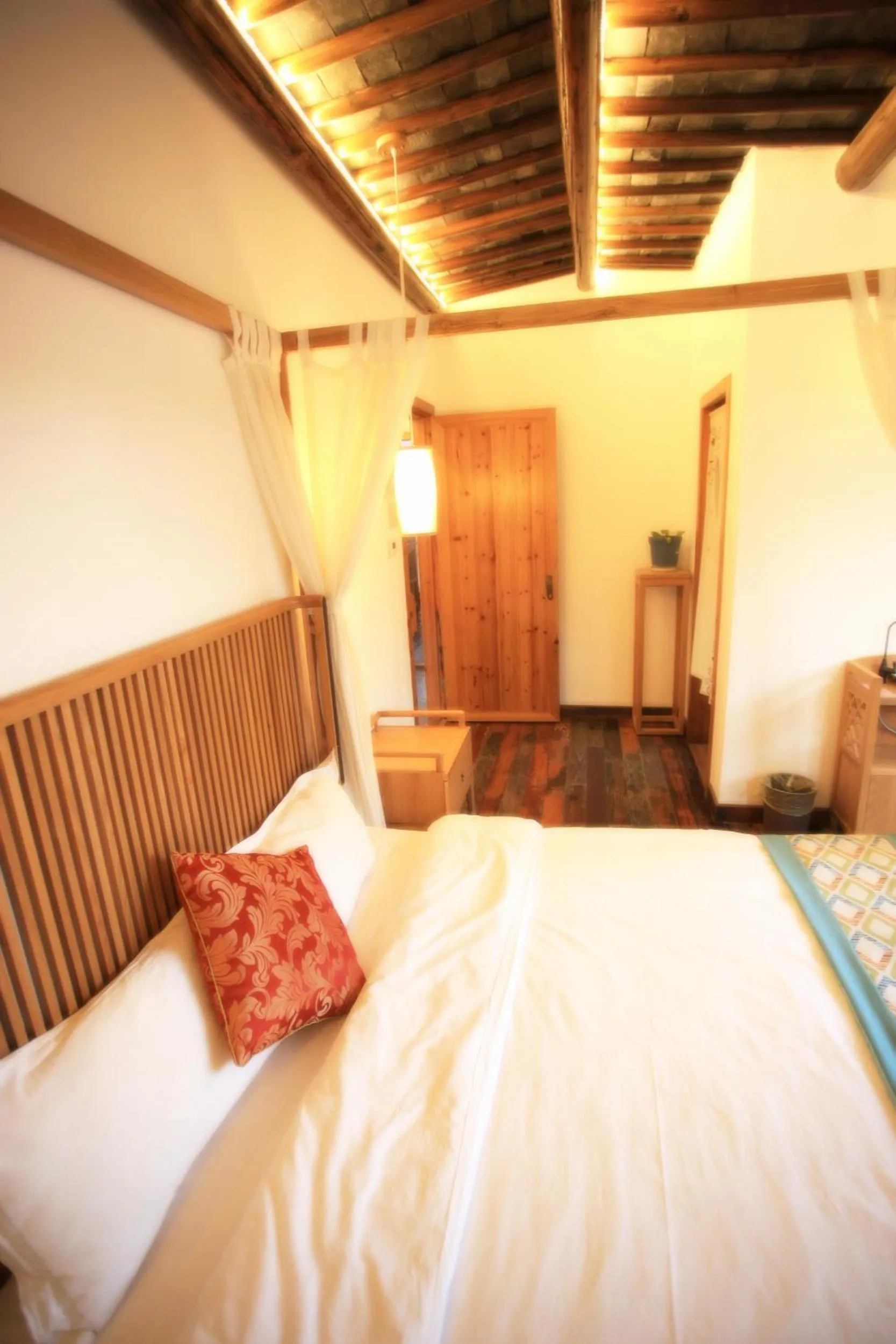 Bed in Tongli Begonia Flowers Guesthouse