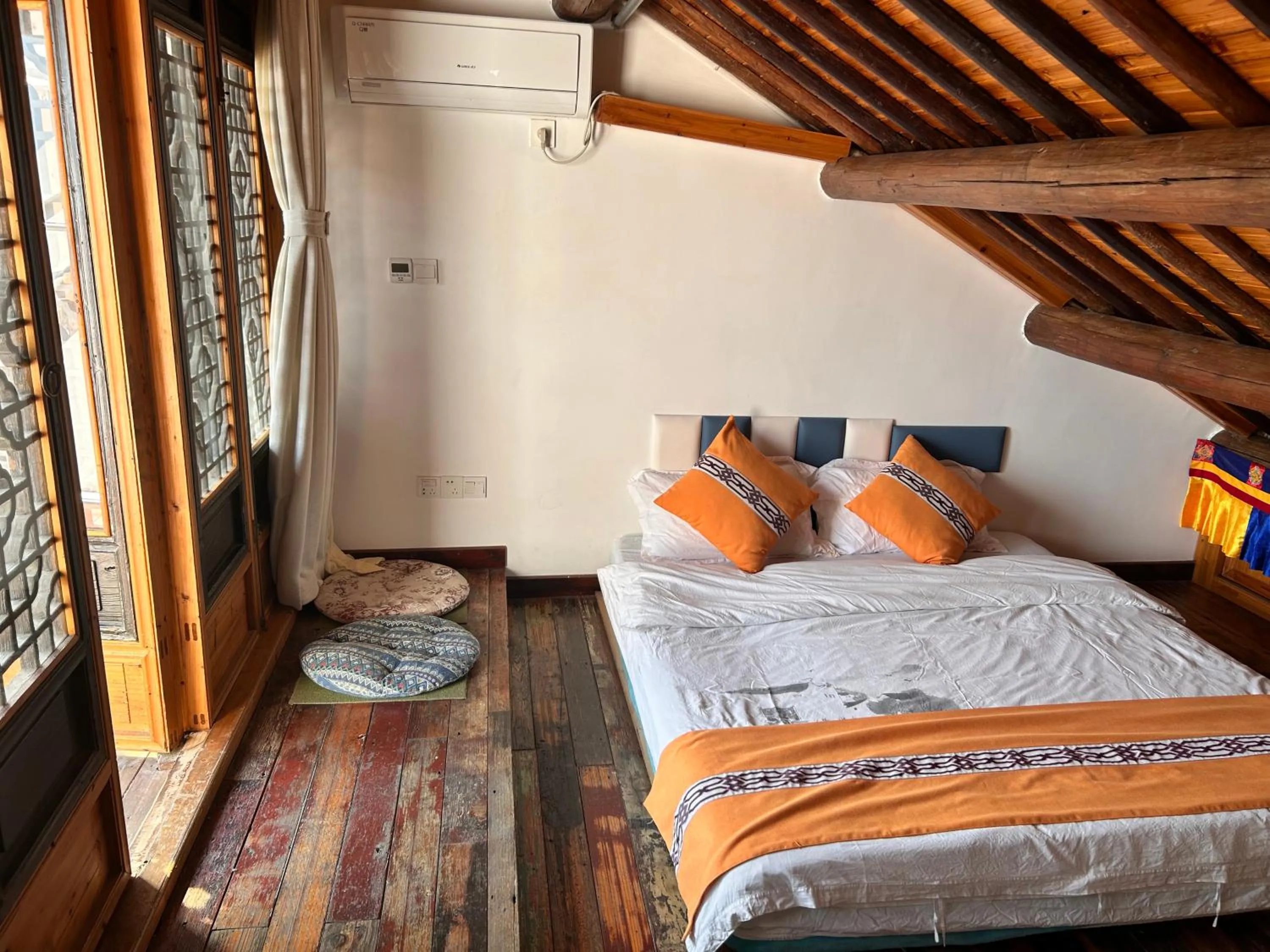 Bed in Tongli Begonia Flowers Guesthouse