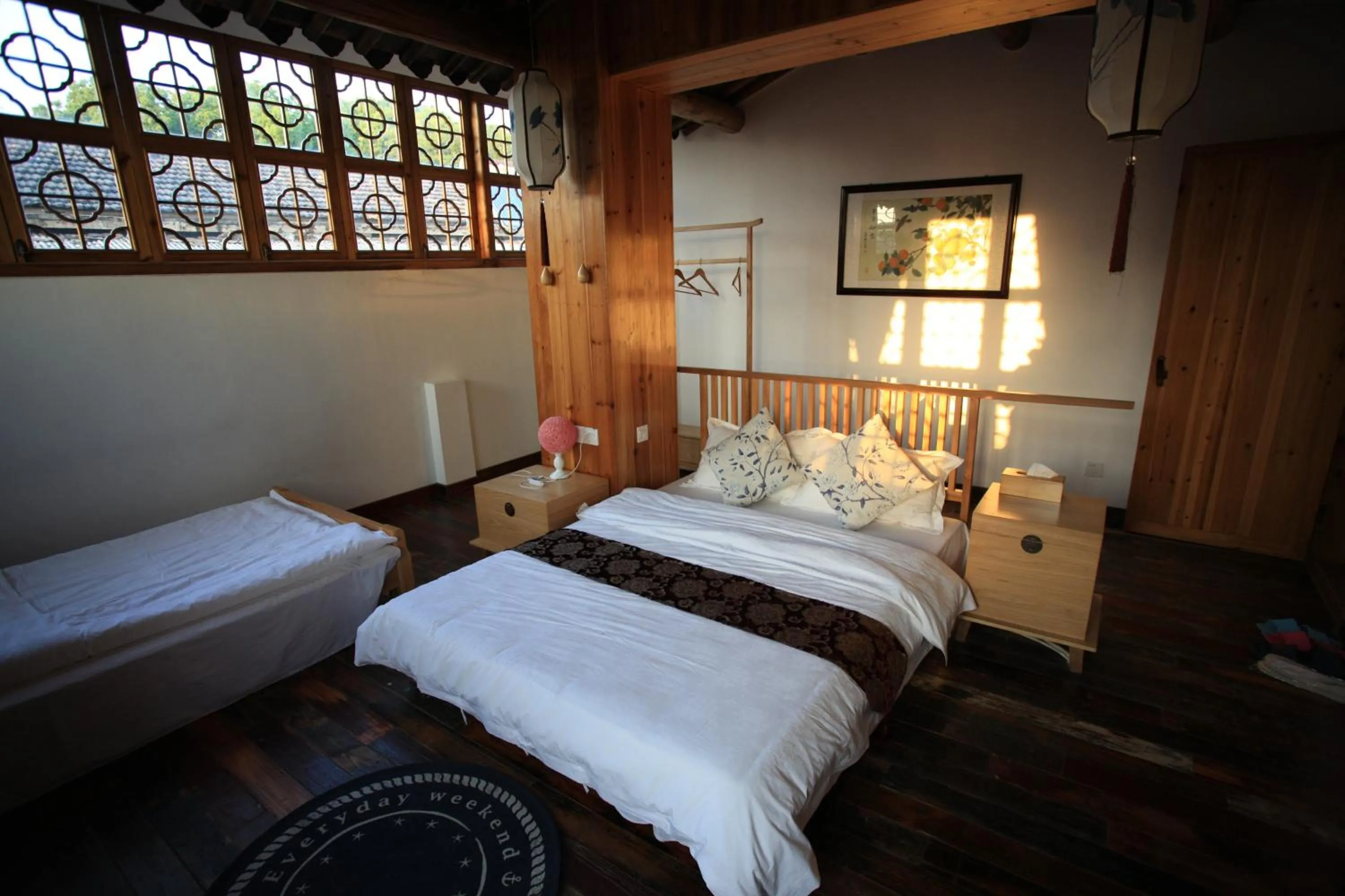 Bed in Tongli Begonia Flowers Guesthouse