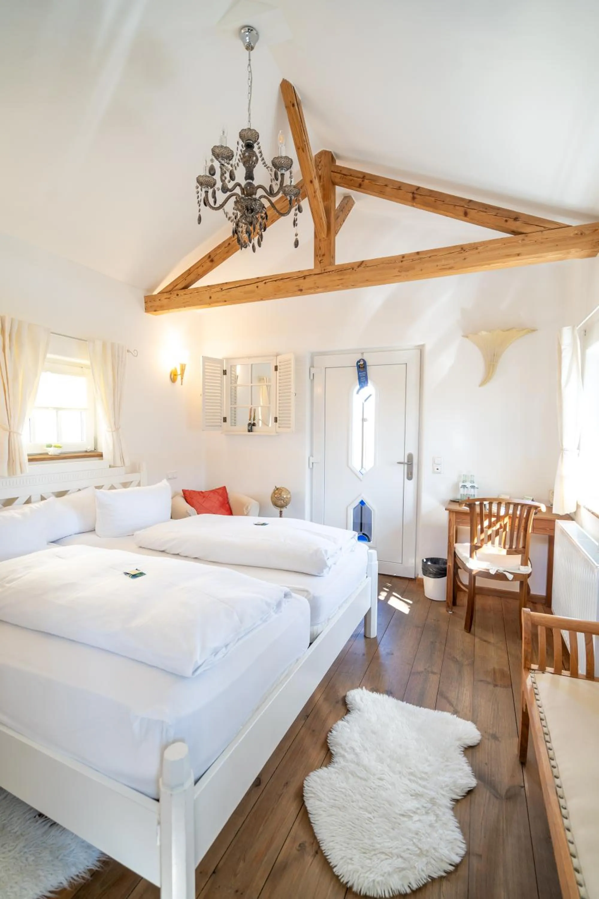 Photo of the whole room, Bed in Landhaus Hotel Wolfratshausen