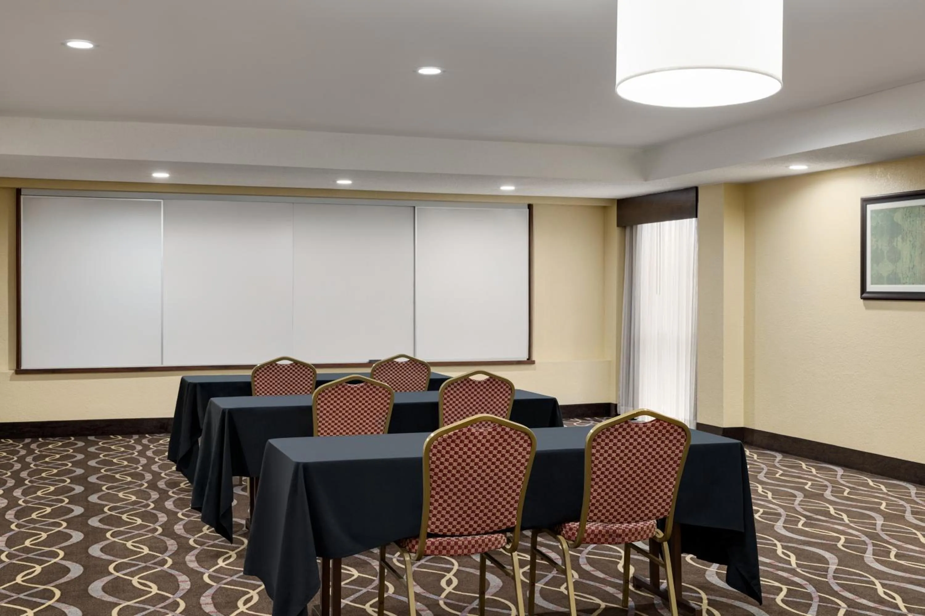 Meeting/conference room in AmericInn by Wyndham Grand Rapids Airport North