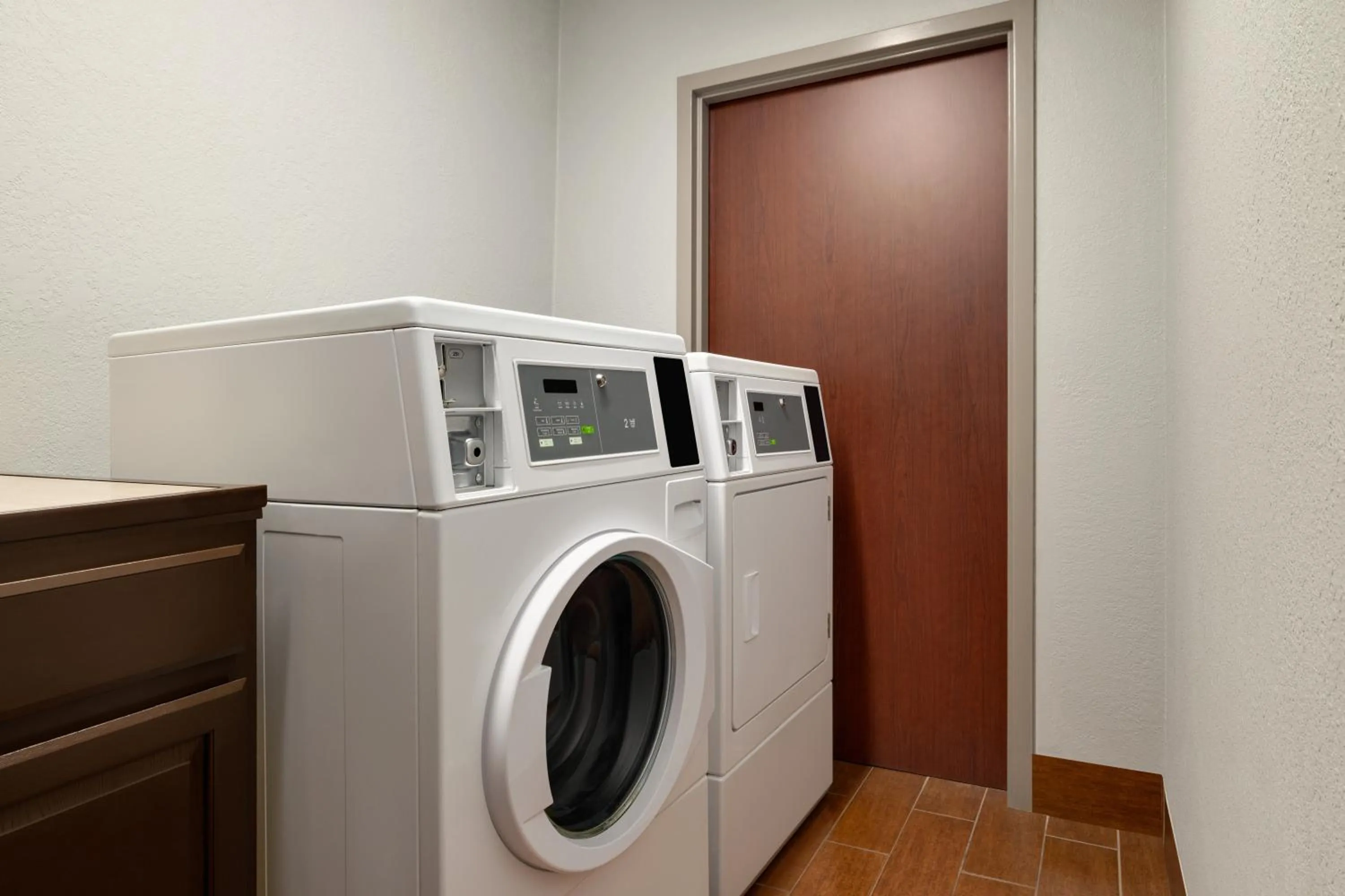 laundry in AmericInn by Wyndham Grand Rapids Airport North