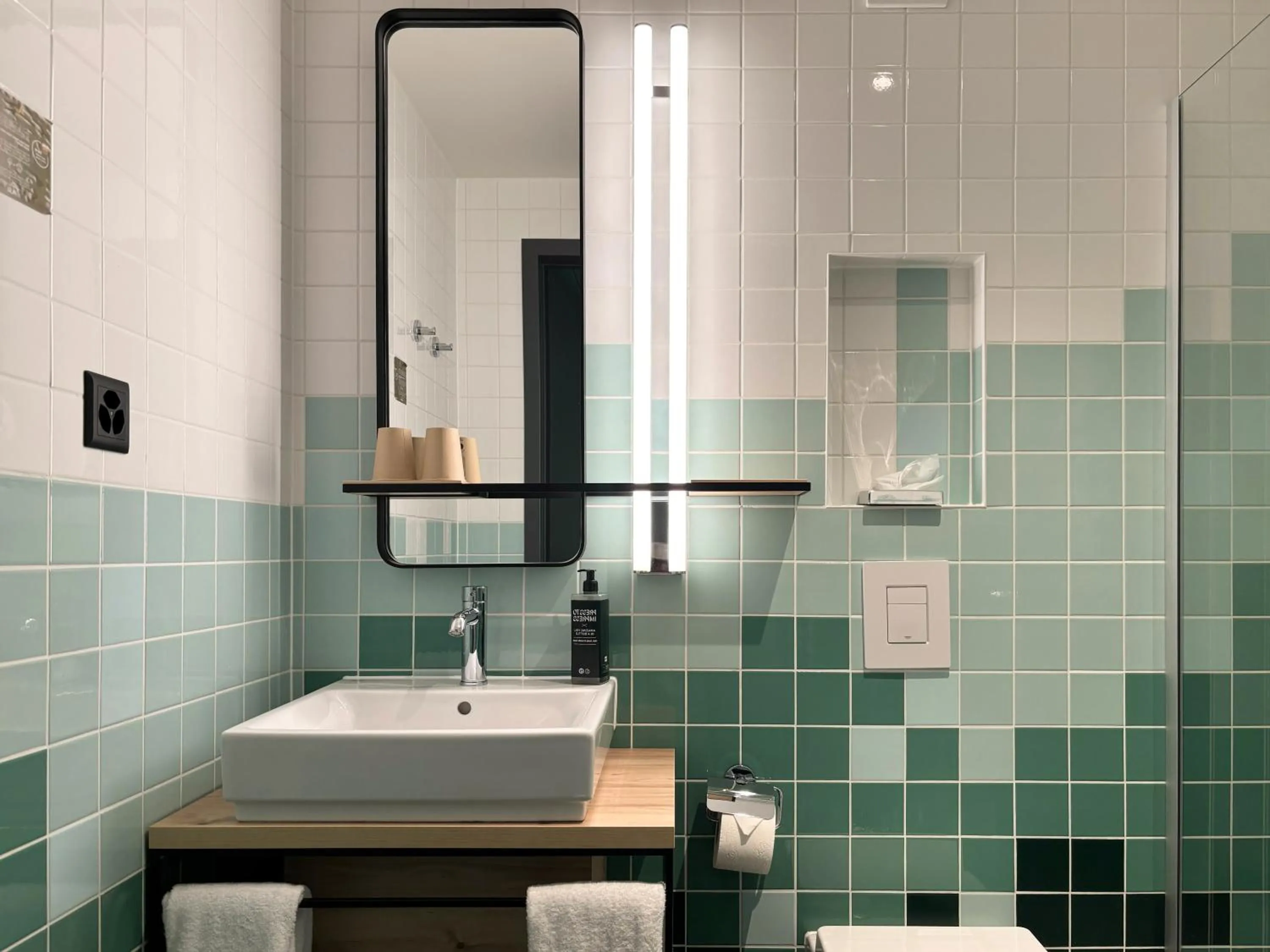 Bathroom in Nonanteneuf Appart-hôtel Sierre - Self Check-in