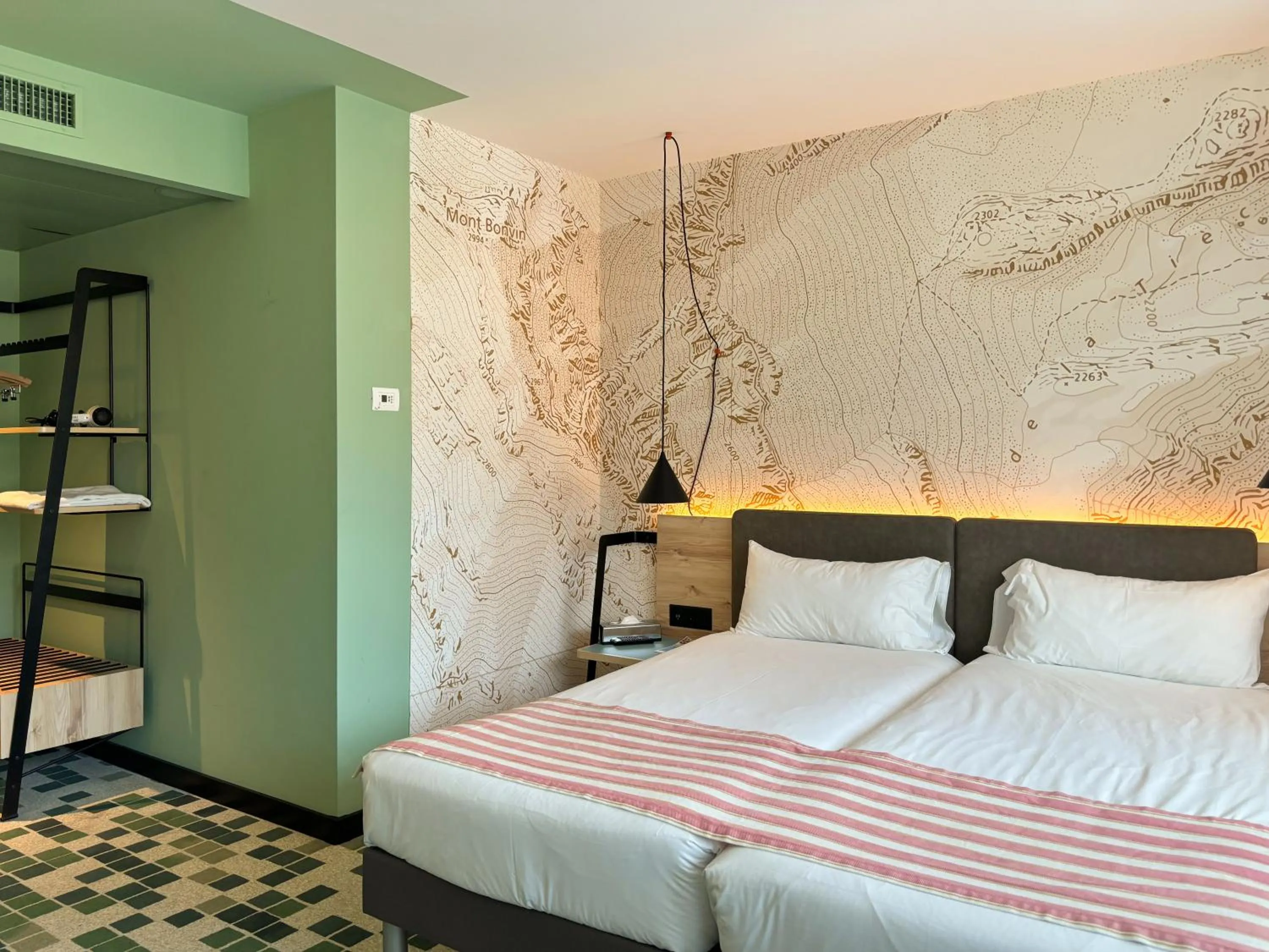 Bed in Nonanteneuf Appart-hôtel Sierre - Self Check-in