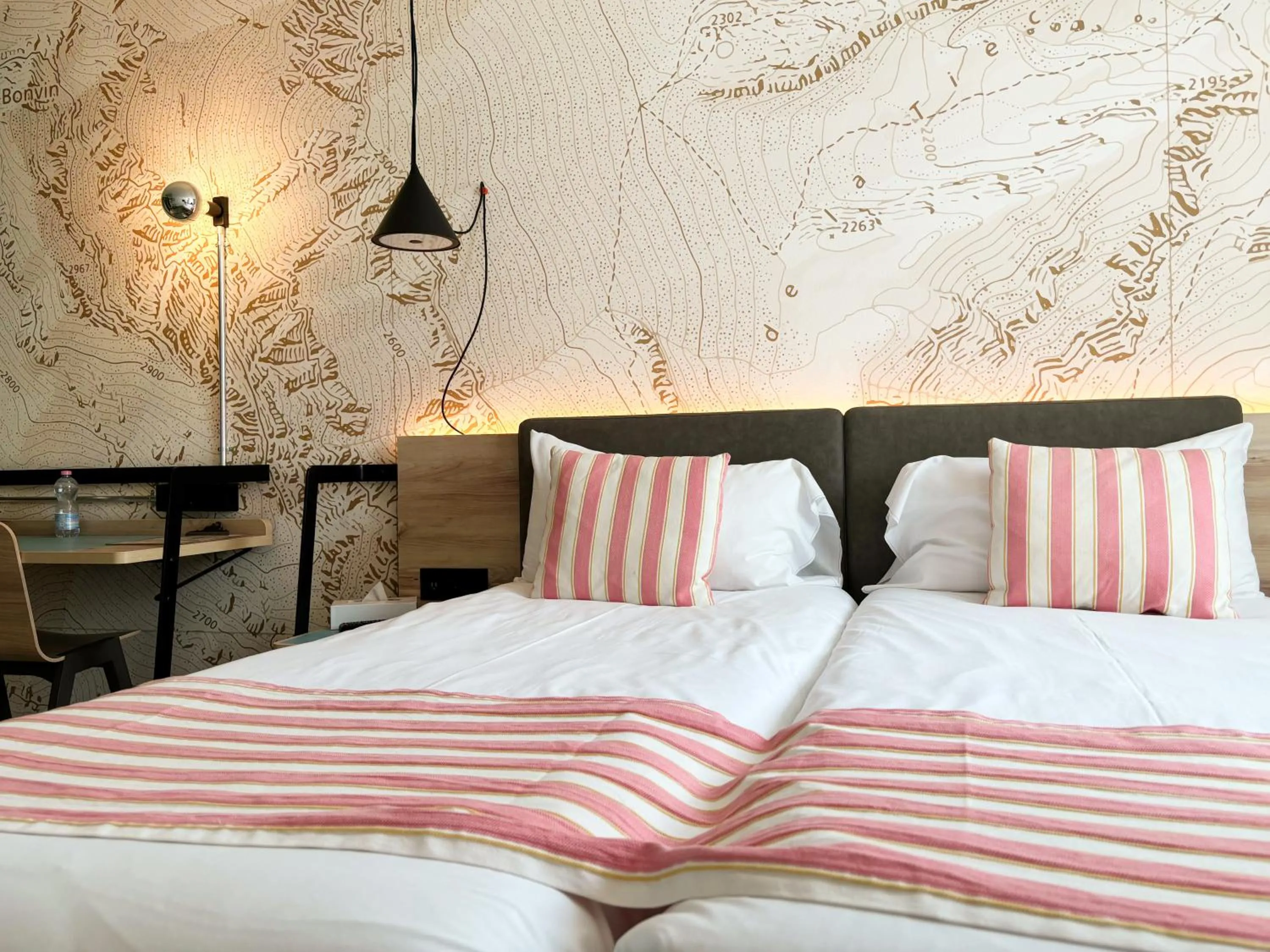 Bed in Nonanteneuf Appart-hôtel Sierre - Self Check-in