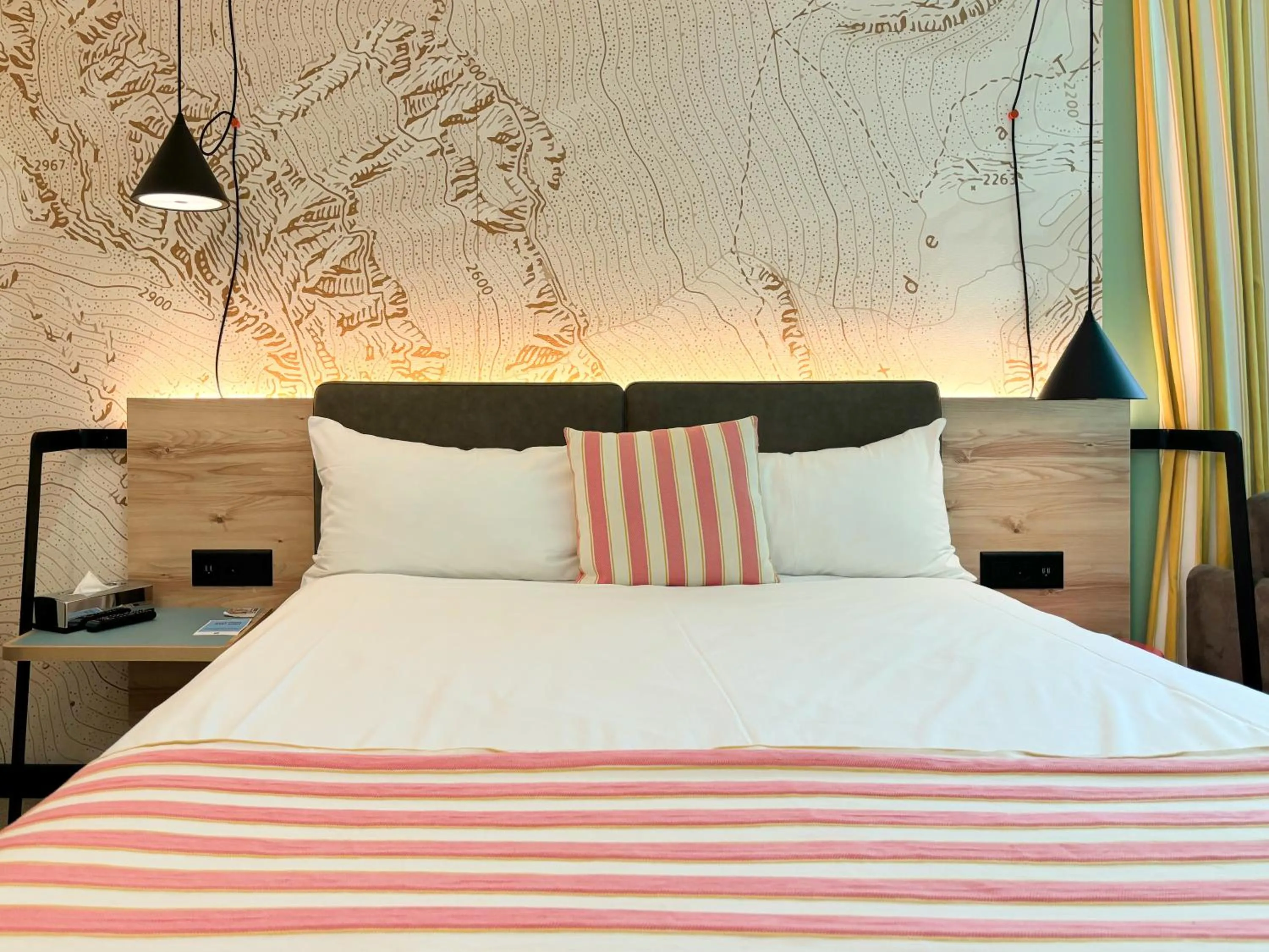 Bed in Nonanteneuf Appart-hôtel Sierre - Self Check-in