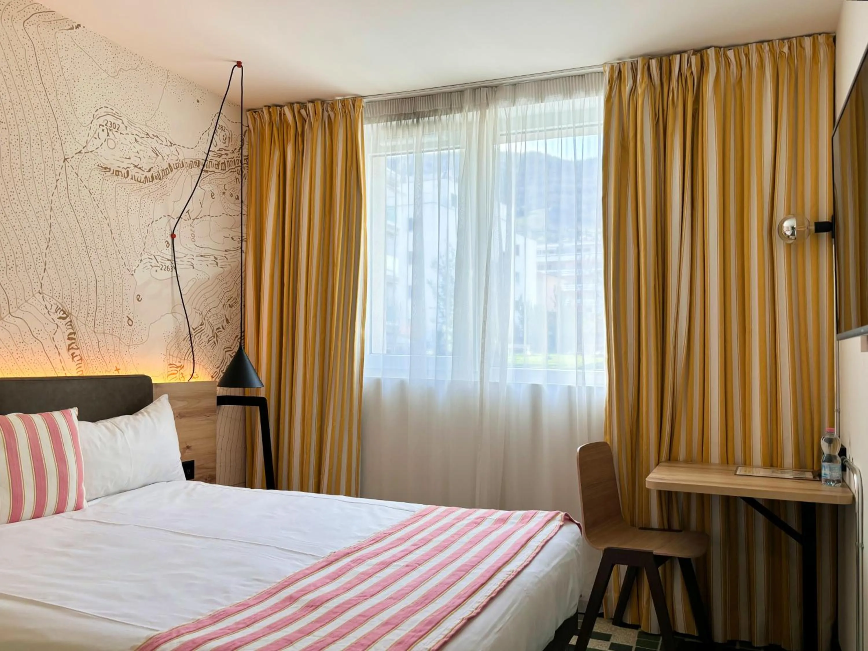 Bed in Nonanteneuf Appart-hôtel Sierre - Self Check-in