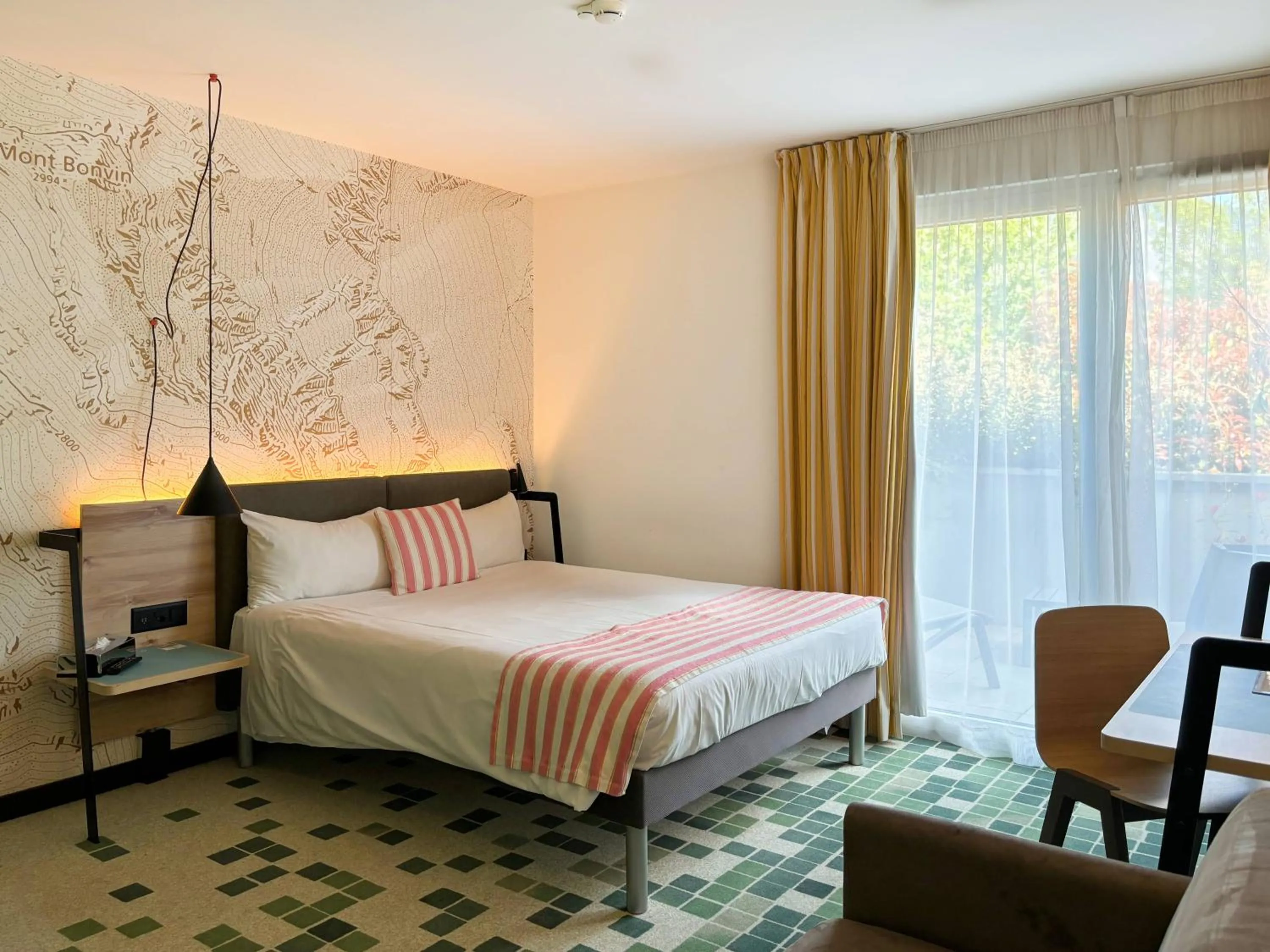 Bed in Nonanteneuf Appart-hôtel Sierre - Self Check-in