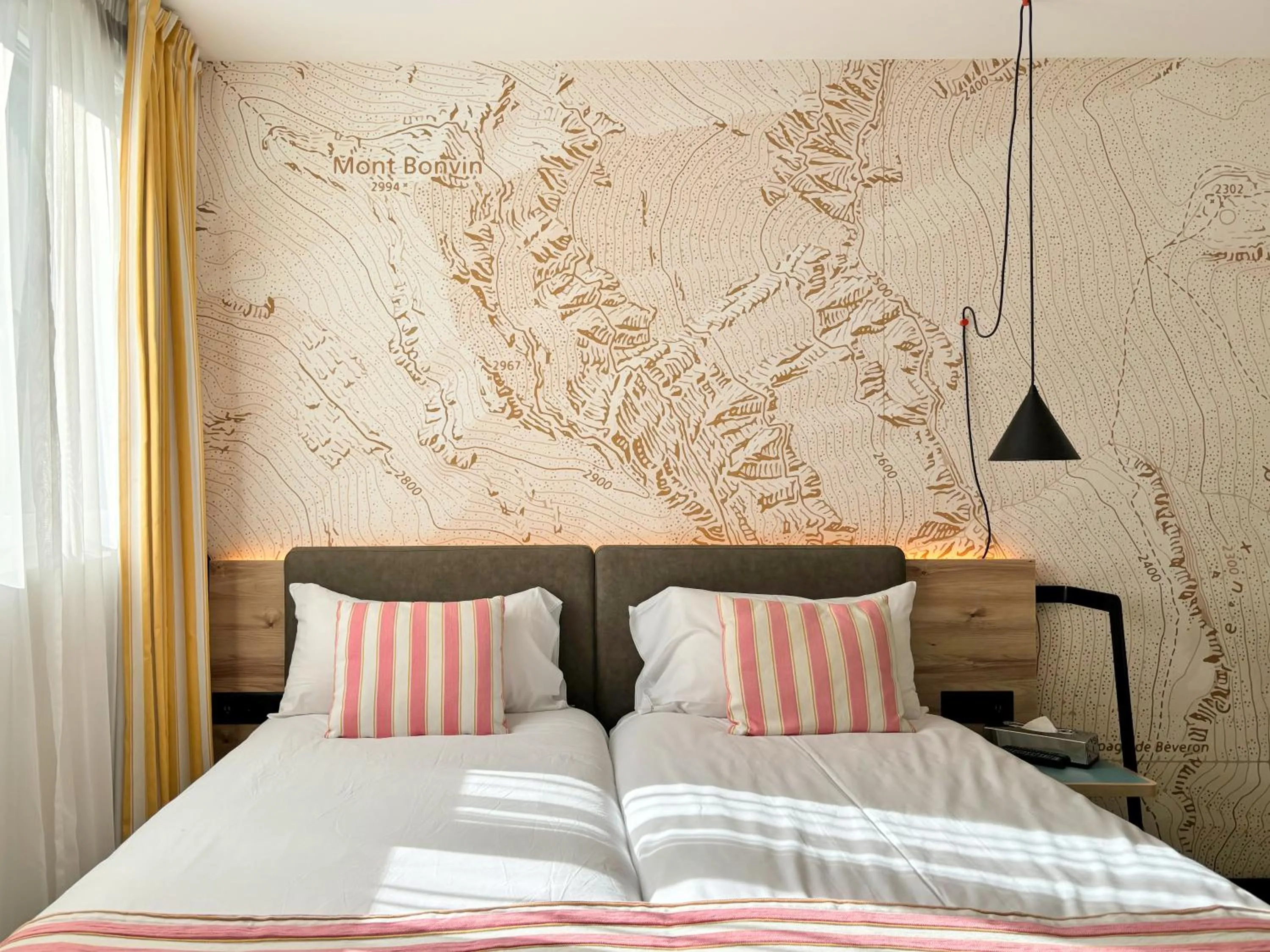 Bed in Nonanteneuf Appart-hôtel Sierre - Self Check-in