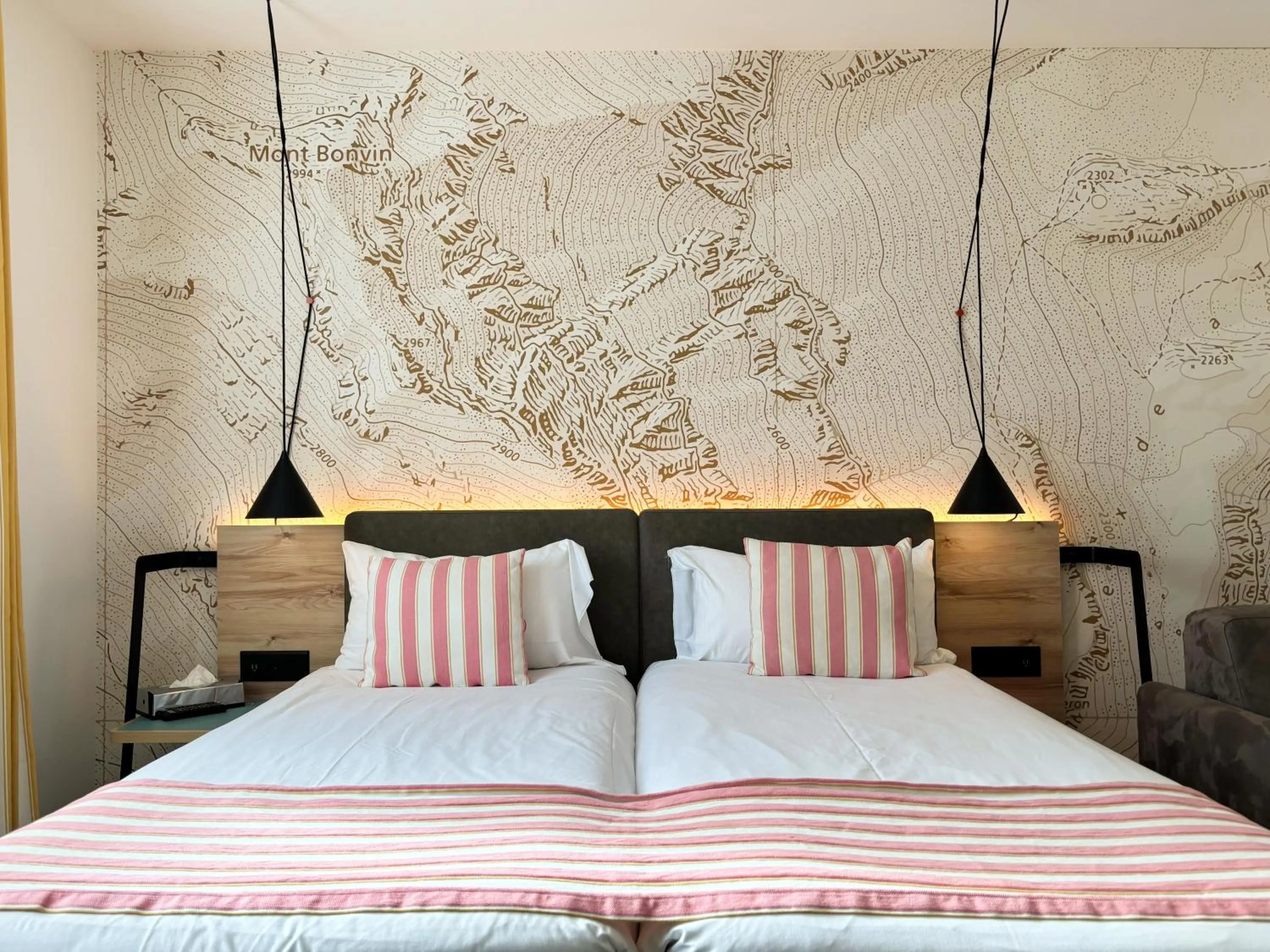 Bed in Nonanteneuf Appart-hôtel Sierre - Self Check-in