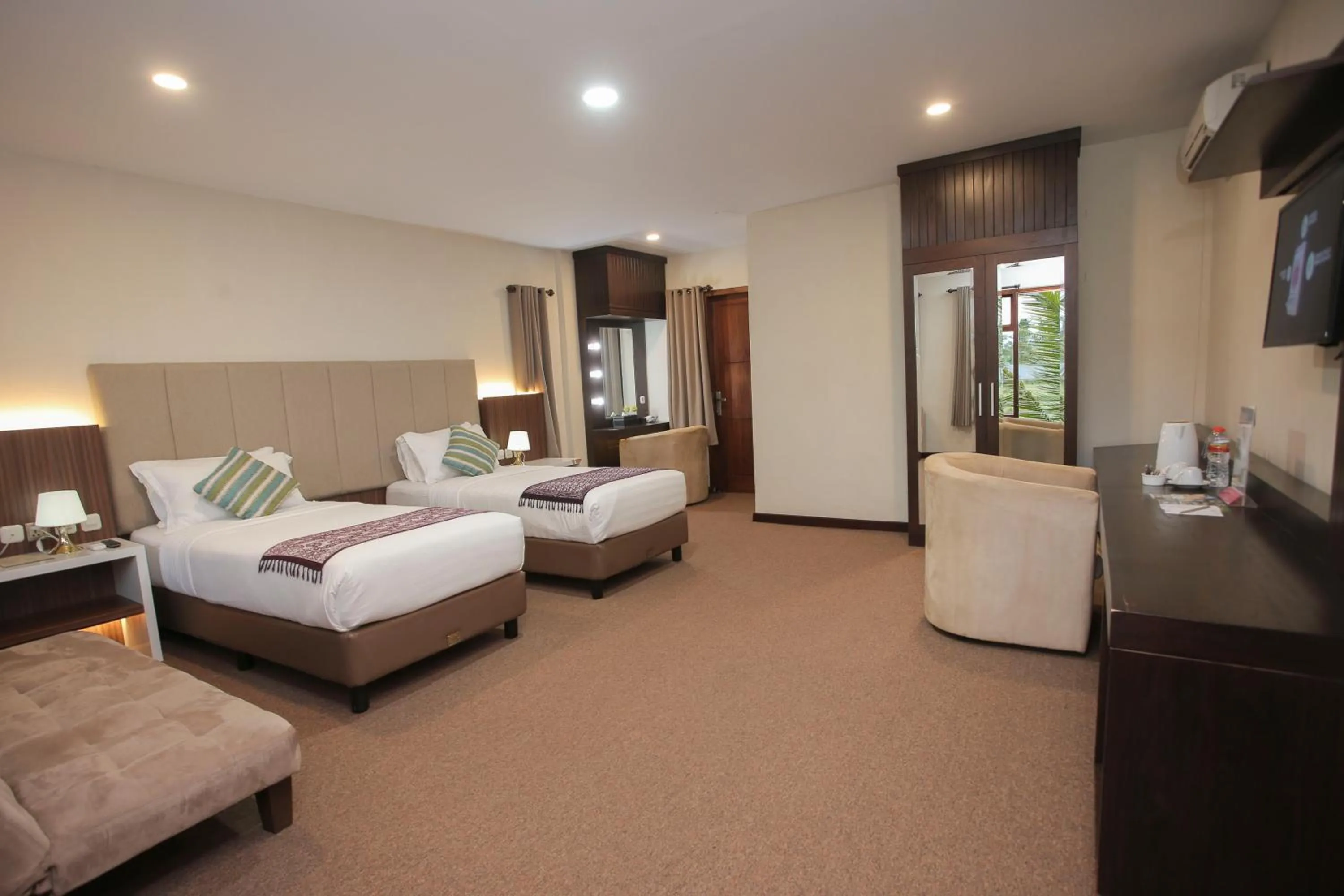 Bed in Grand Harvest Resort & Villas