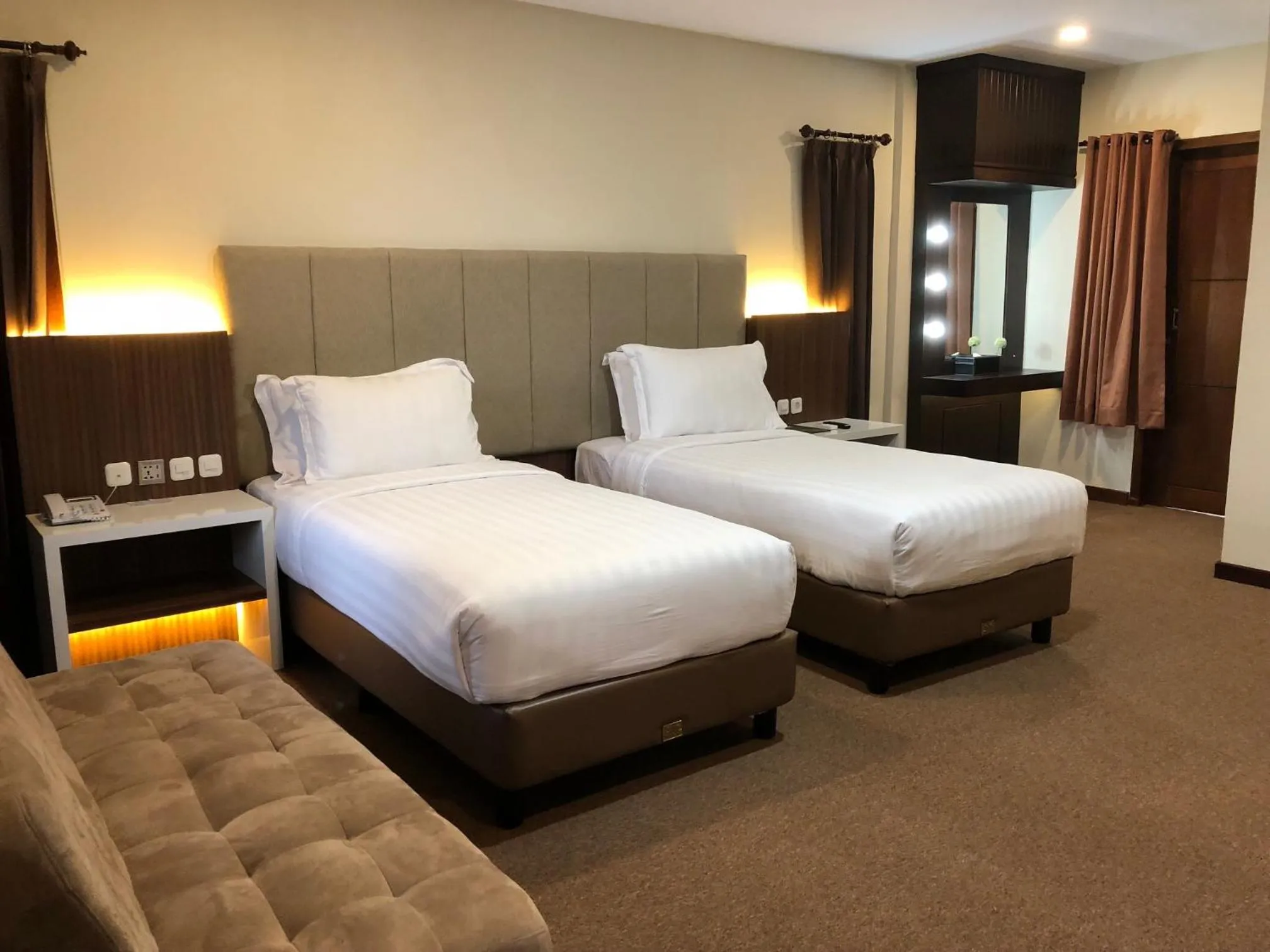 Bed in Grand Harvest Resort & Villas