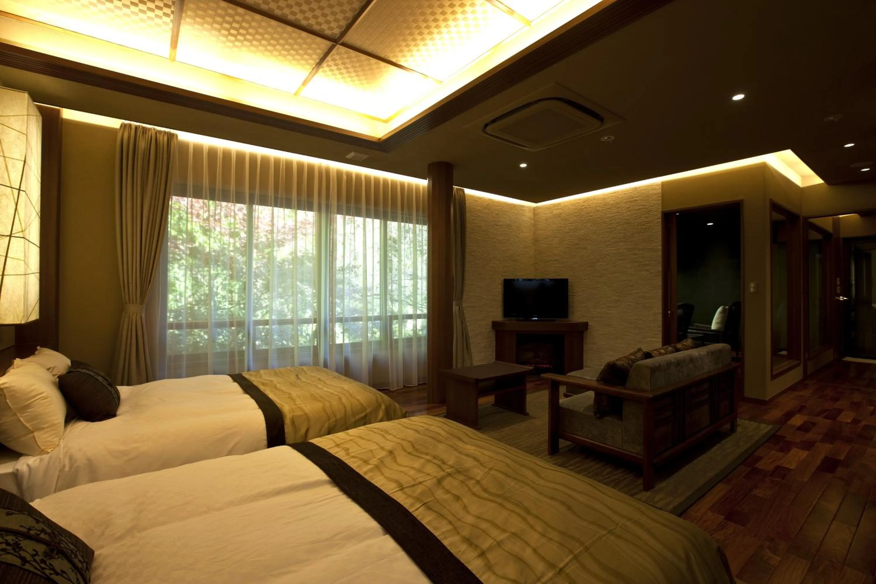 Bedroom, Bed in TAKITEI Riverside Onsen ーA Hidden Ryokan in Kanazawaー