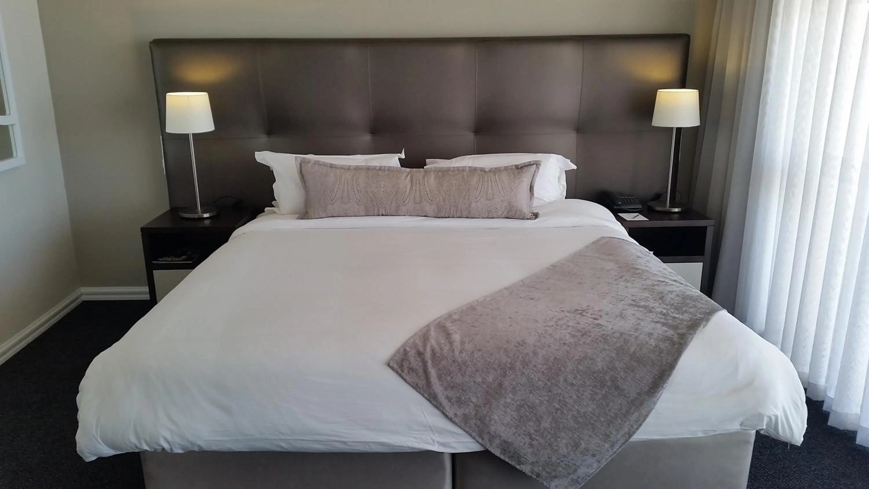 Bed in Lagoon Beach Hotel Apartments