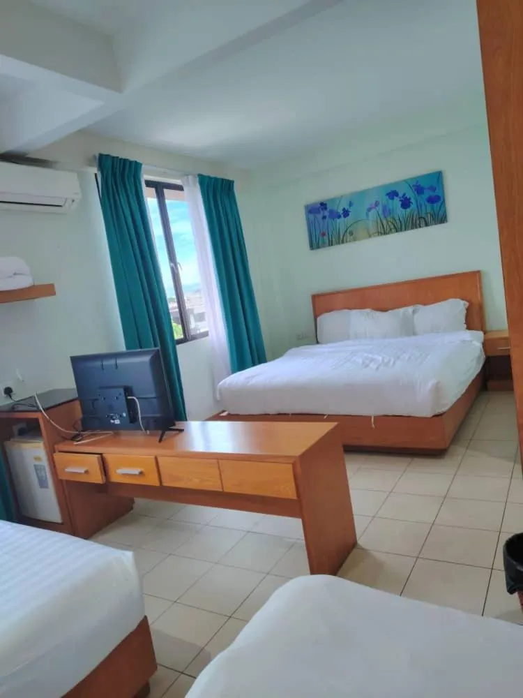 Communal lounge/ TV room in Fratini's Hotel Labuan