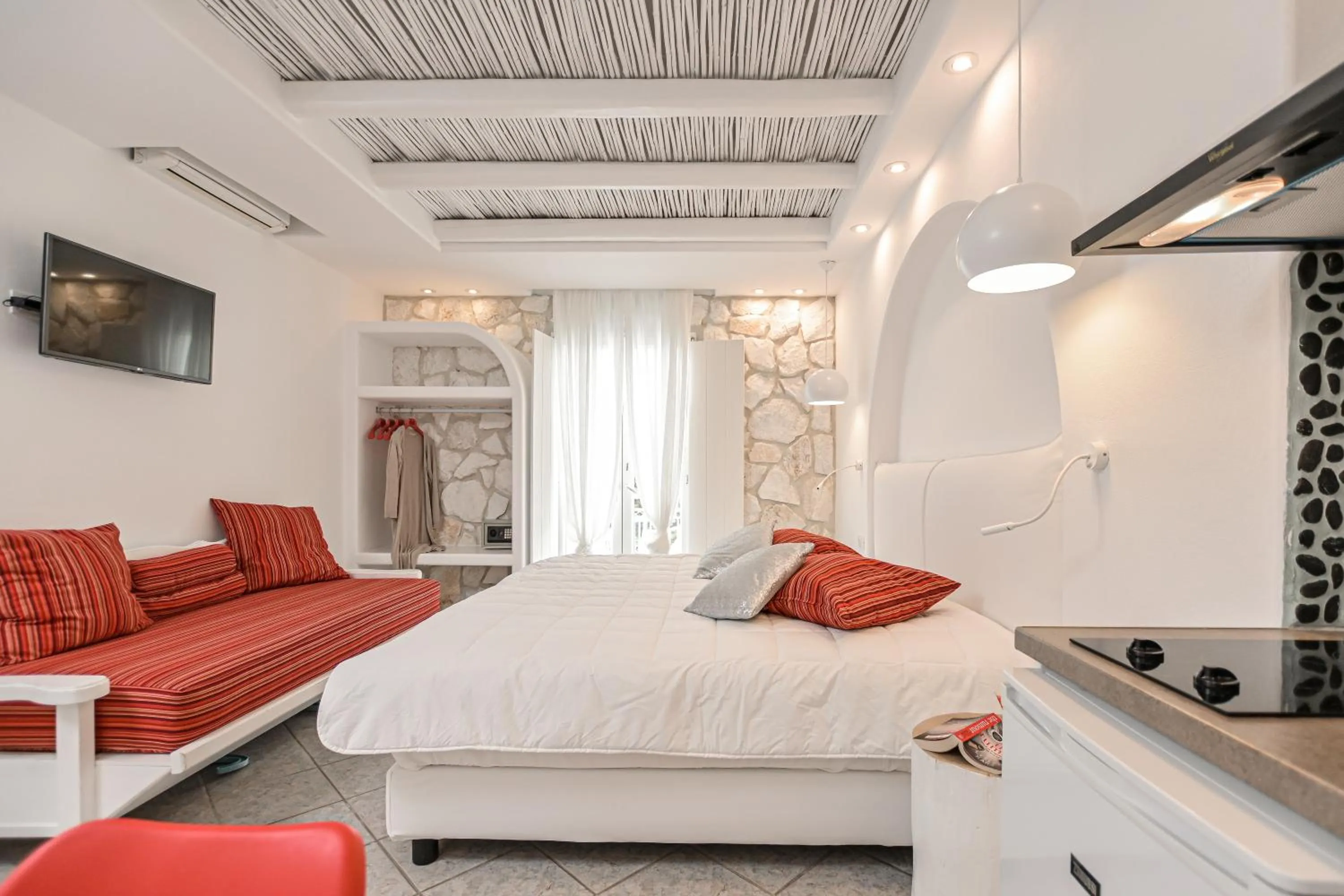 Bed in Naxos Evilion Luxury Apartments & Suites