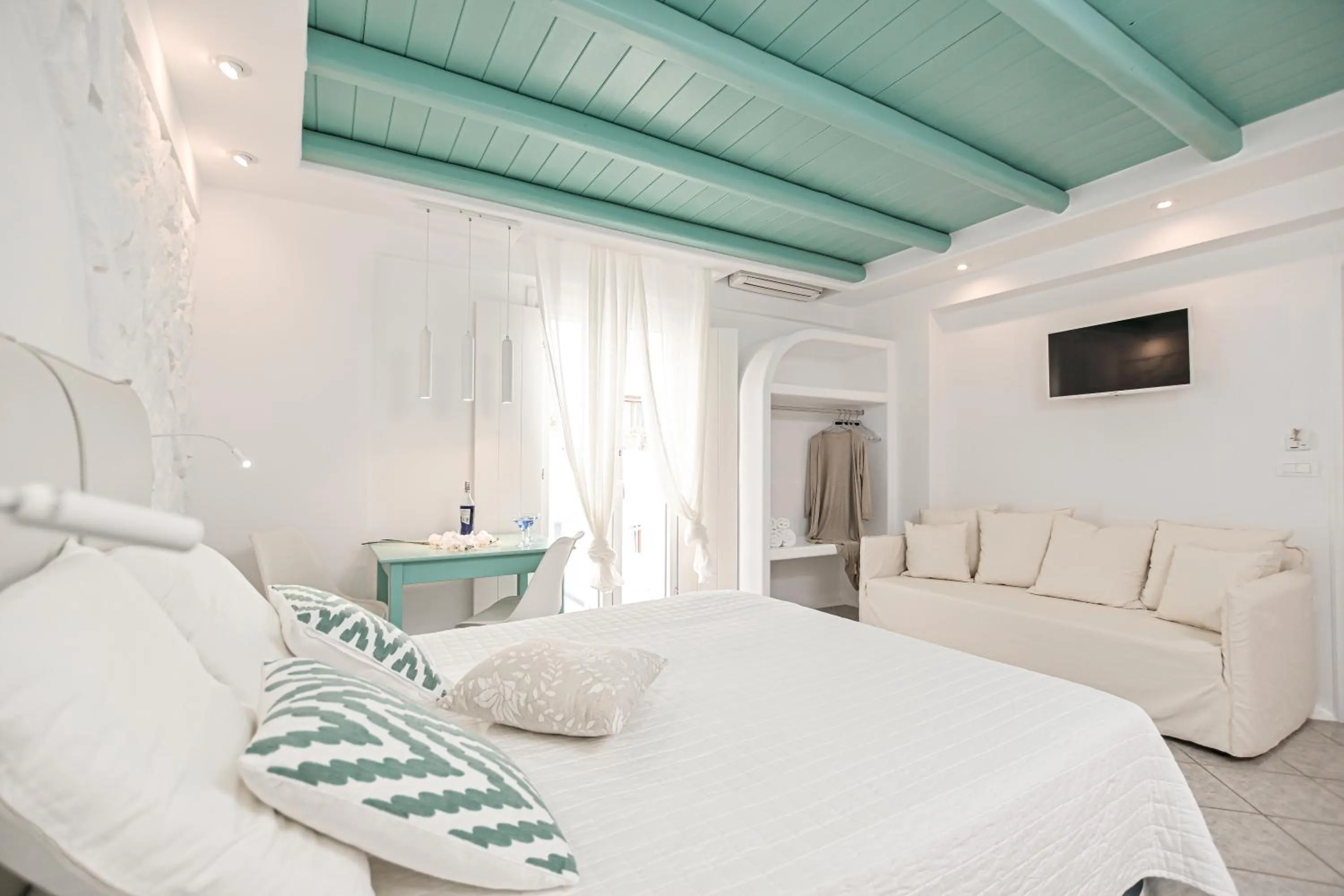 Bed in Naxos Evilion Luxury Apartments & Suites
