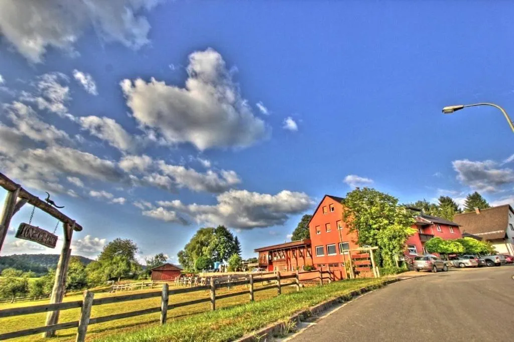 Property building in Longhorn Ranch Countryhotel - Garni